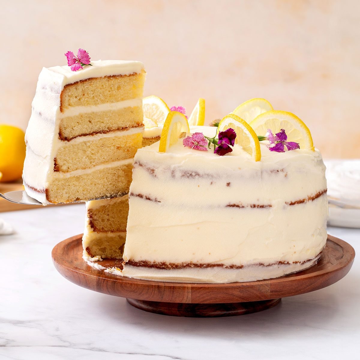 Lemon Cake Slice Being Pulled Out For Lemon Cake Recipe