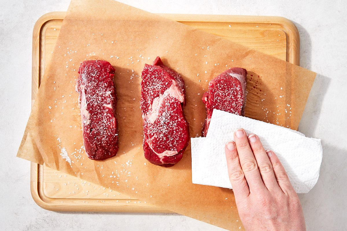 Filet Mignon Step 3- patting steaks dry with a paper towel