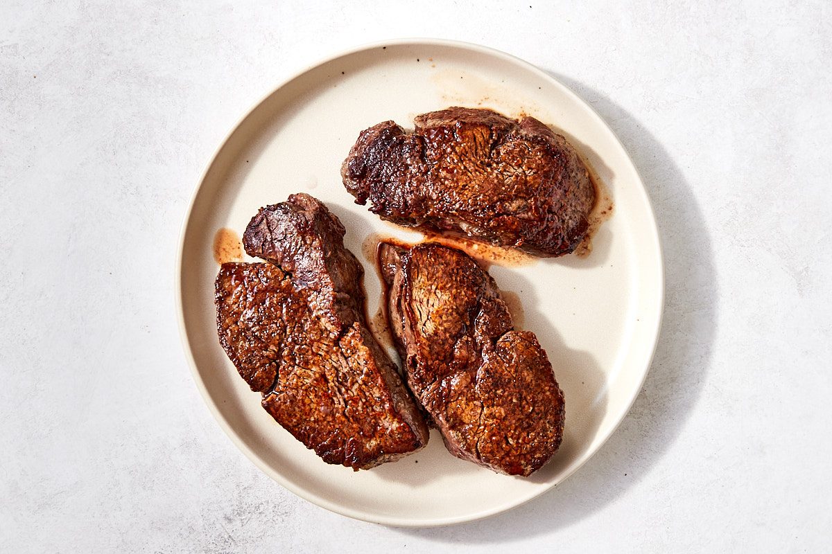 Filet Mignon Step 5- cooked steaks resting on a plate