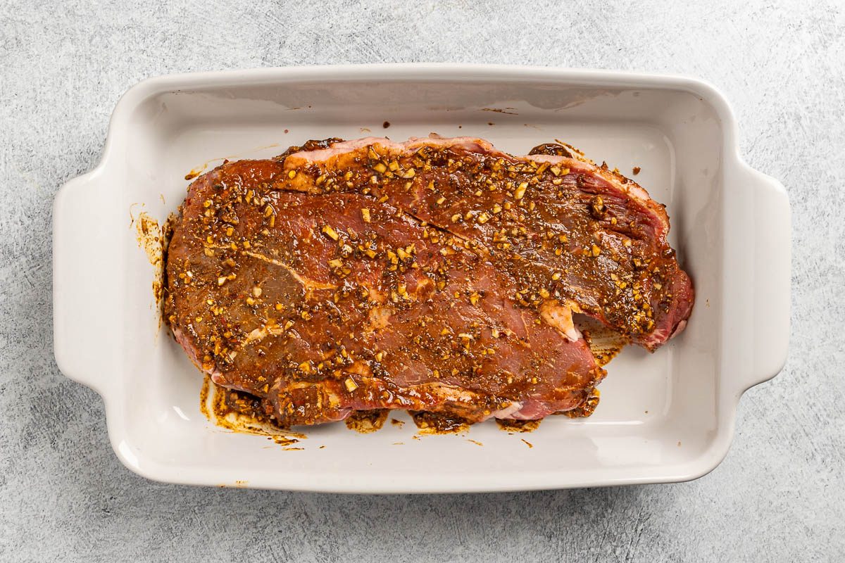 Taste of Home Grilled Flat Iron Steak recipe photo of the beef coated in the marinade.