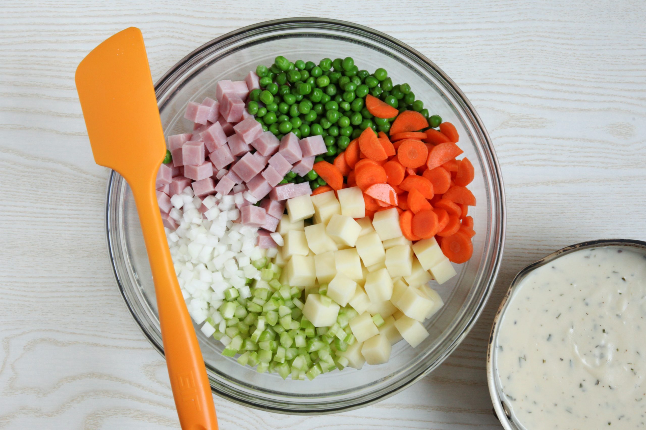 Mixing together the filling for ham potpie