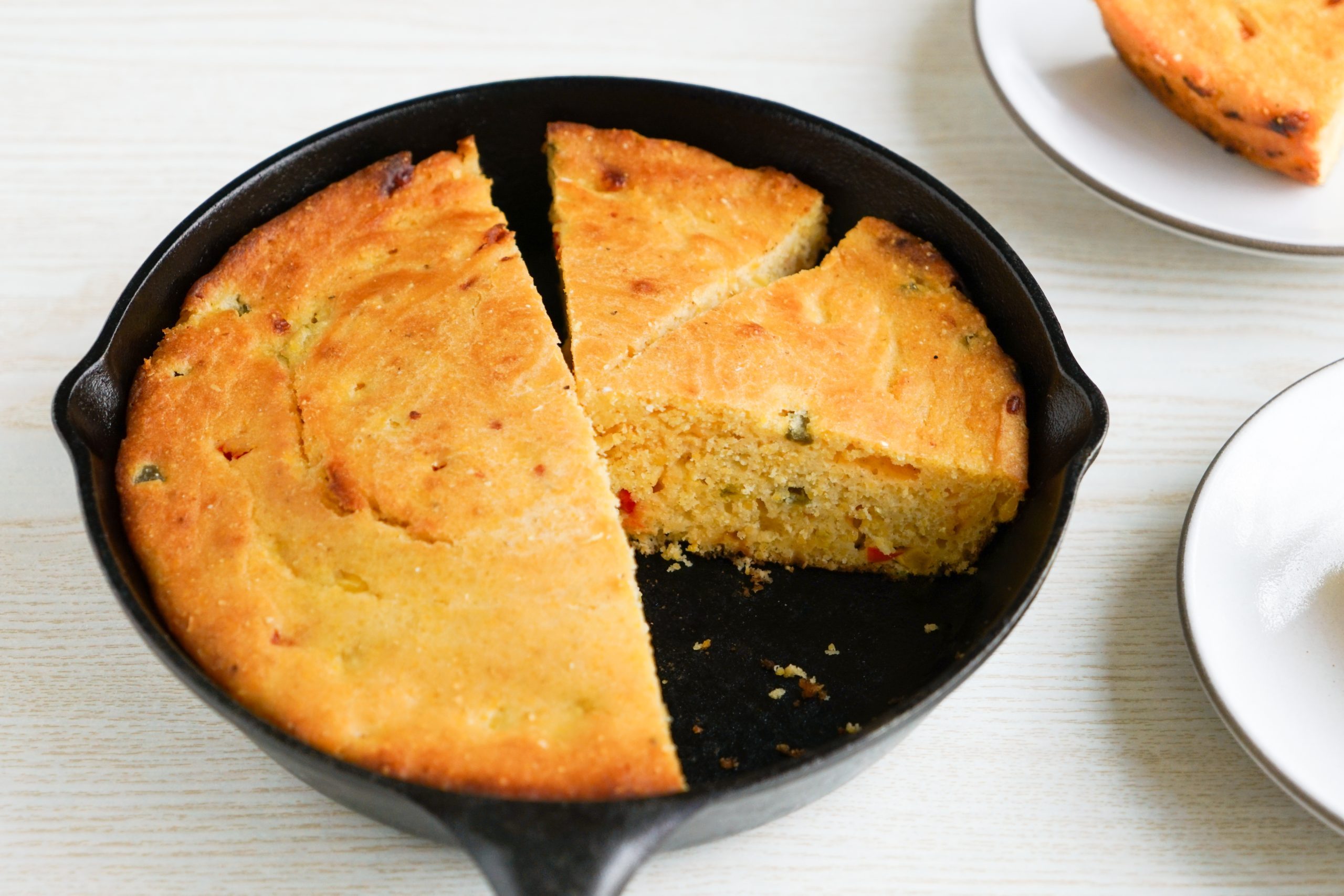 Jalapeño buttermilk cornbread in a cast iron skillet