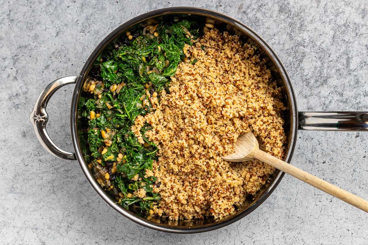 Taste of Home Kale Quinoa Salad recipe photo of the cooked veggies, quinoa, and dressing combined.