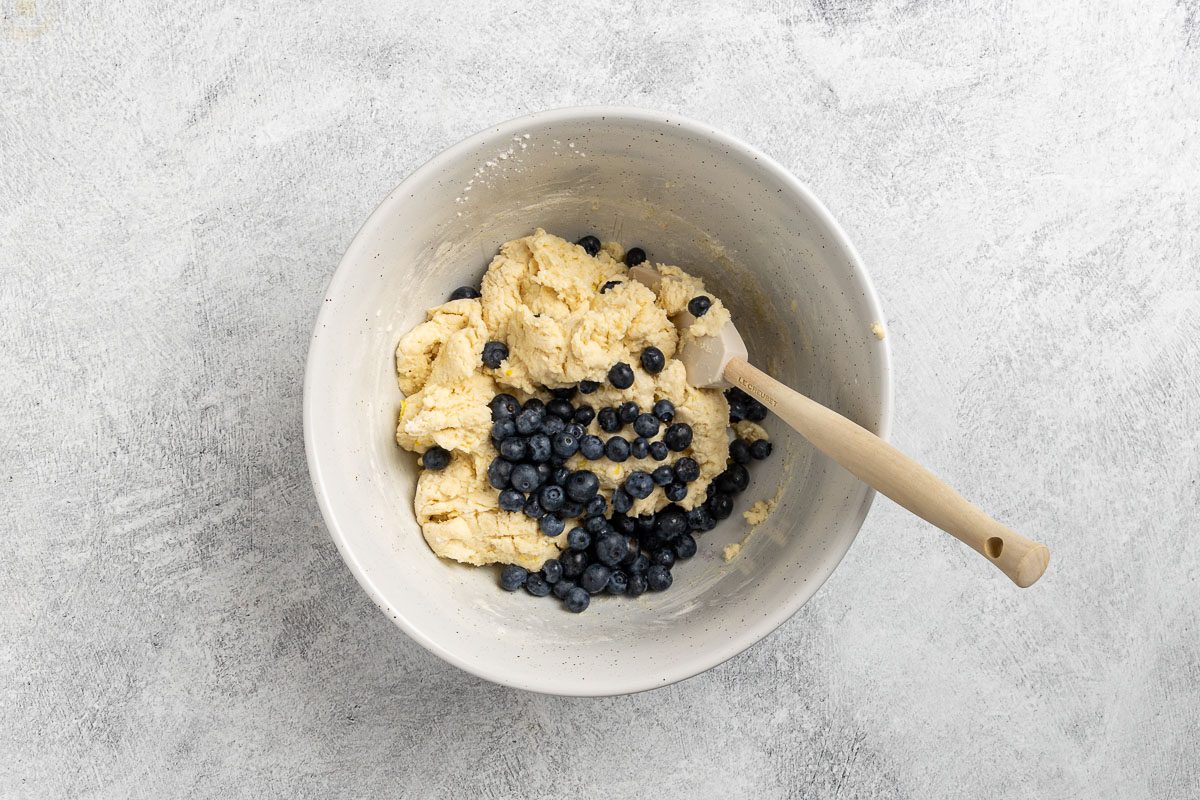 Taste of Home Lemon Blueberry Scones recipe photo of folding the blueberries into the dough.