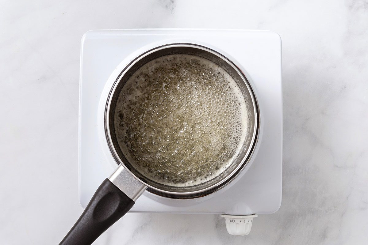 Boiling sugar and lemon juice on hotplate for step 4 of Lemon Cake recipe for Taste Recipes