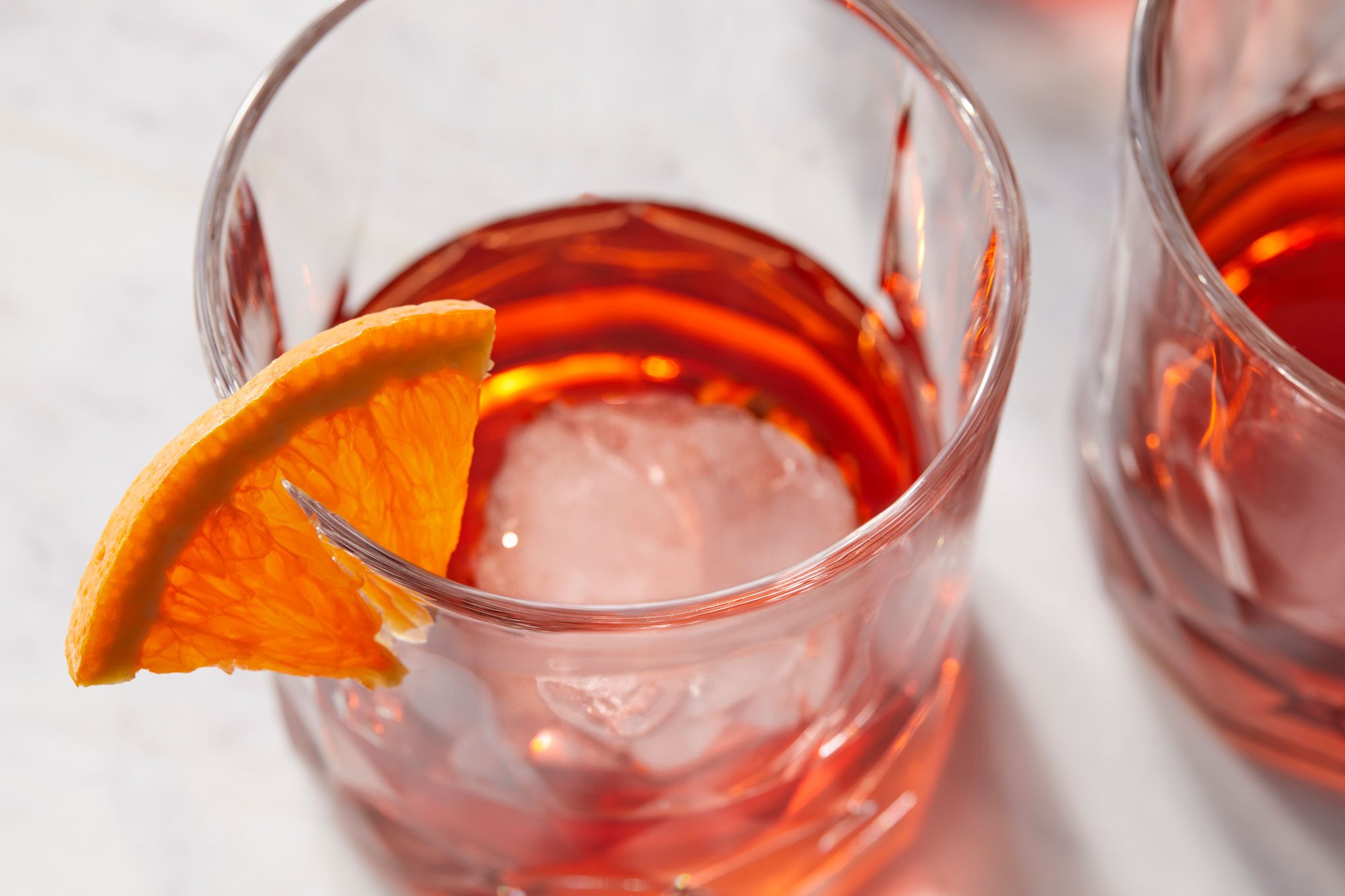 high angle shot of mezcal negroni garnished with orange peel