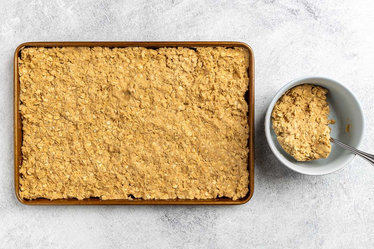 Taste of Home Oatmeal Brownies recipe photo of making the oatmeal brownie layer and setting it into a 15 x 10 x 1 baking sheet.