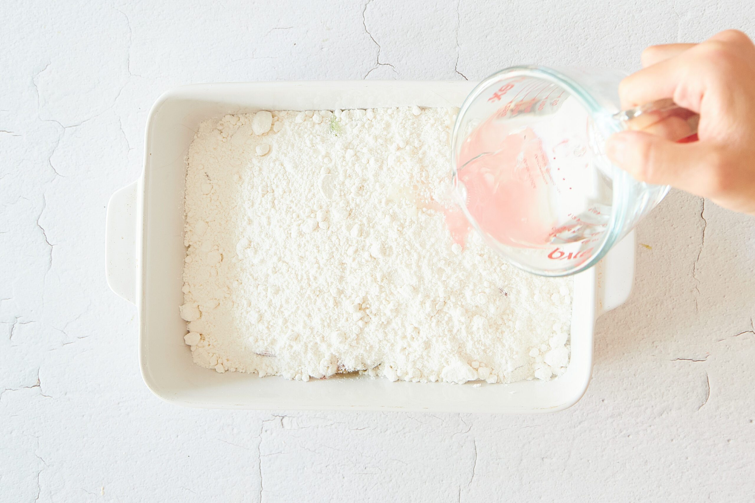 Pour the water over the rhubarb dump cake