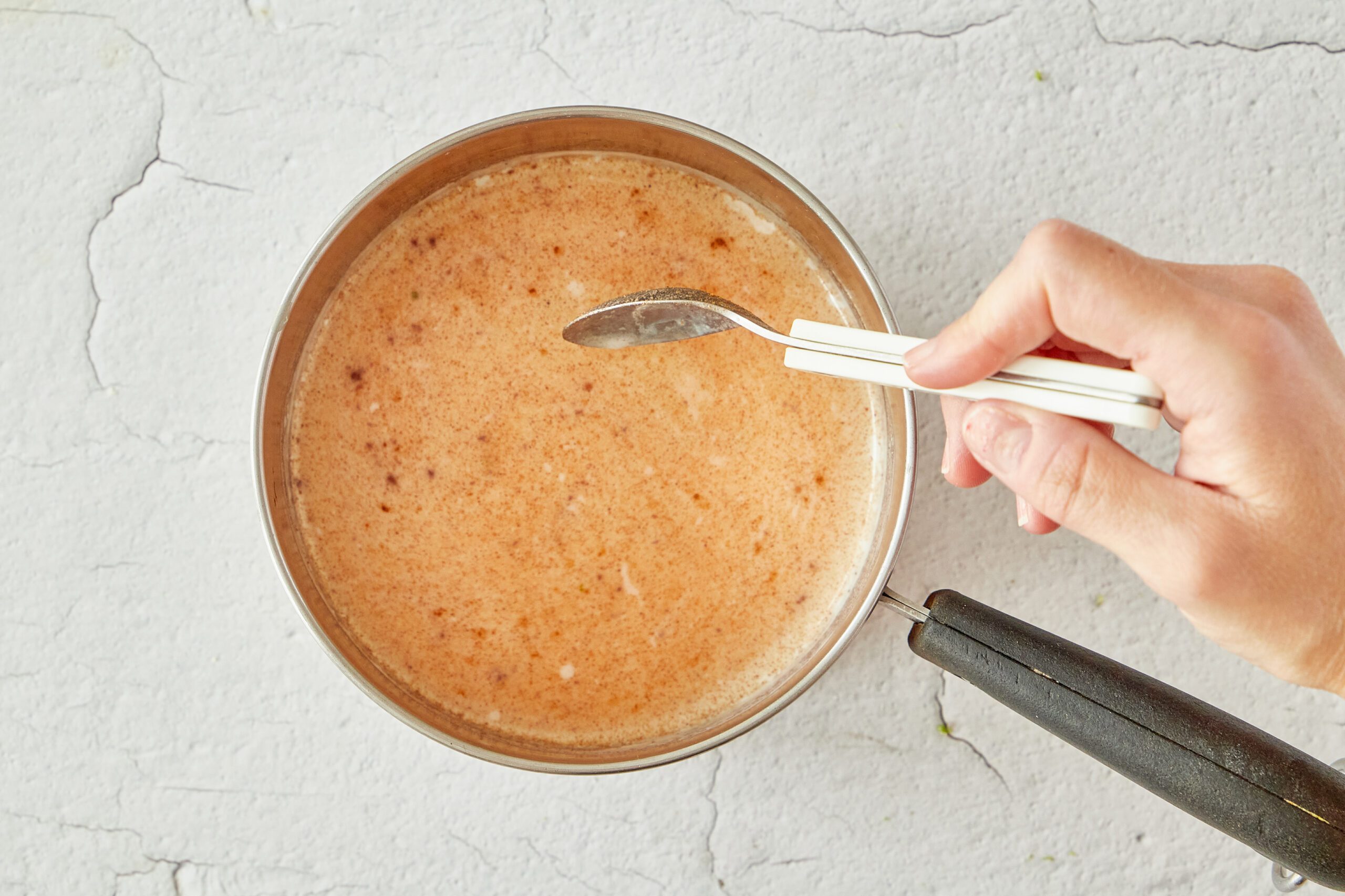 Heat the pumpkin milk for the pumpkin spice latte.