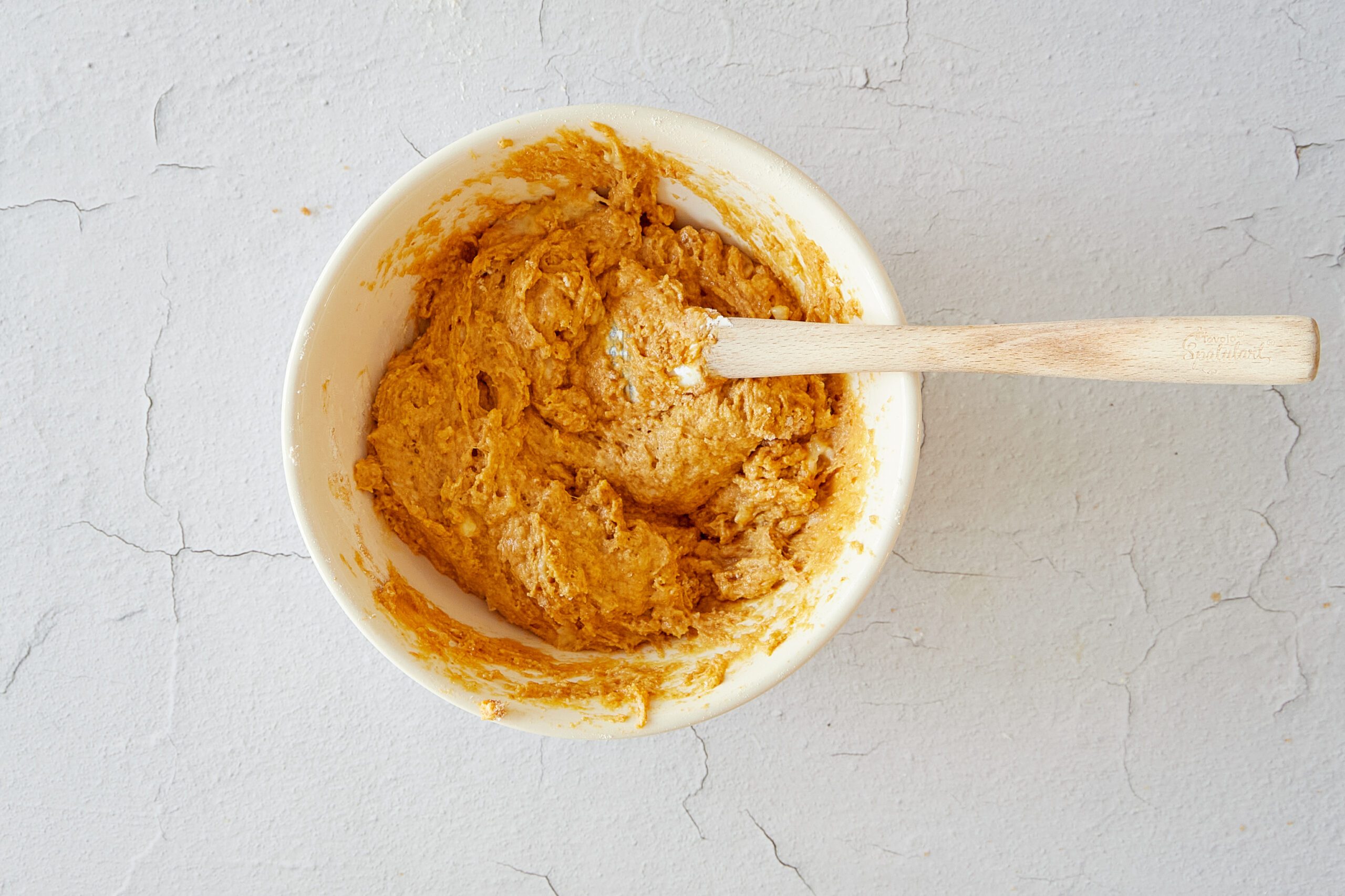 Mix the batter for pumpkin banana muffins