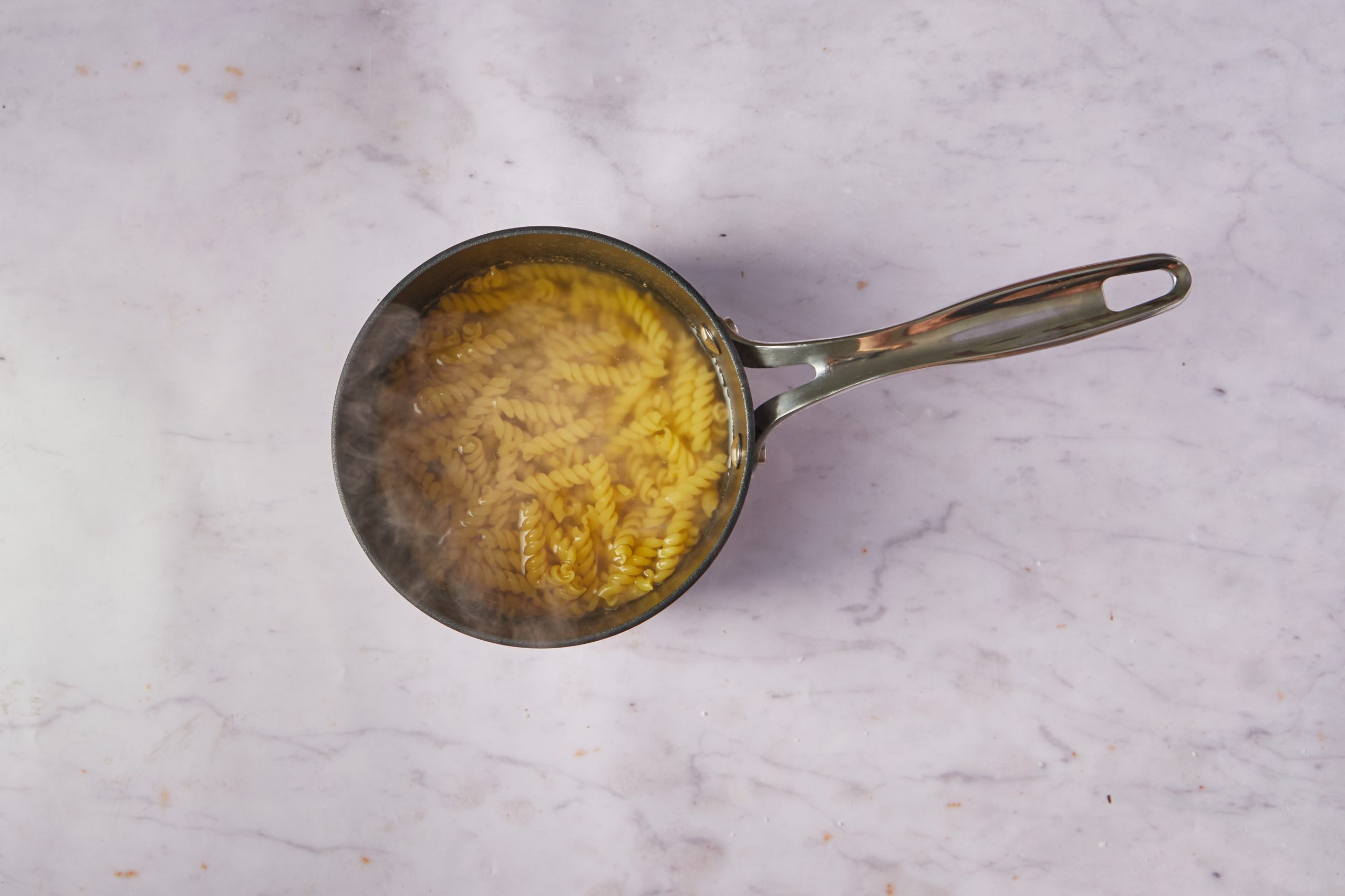 Cook the pasta for chicken pasta salad.