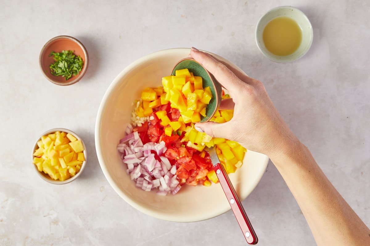 mixing ingredients for Peach Mango Salsa