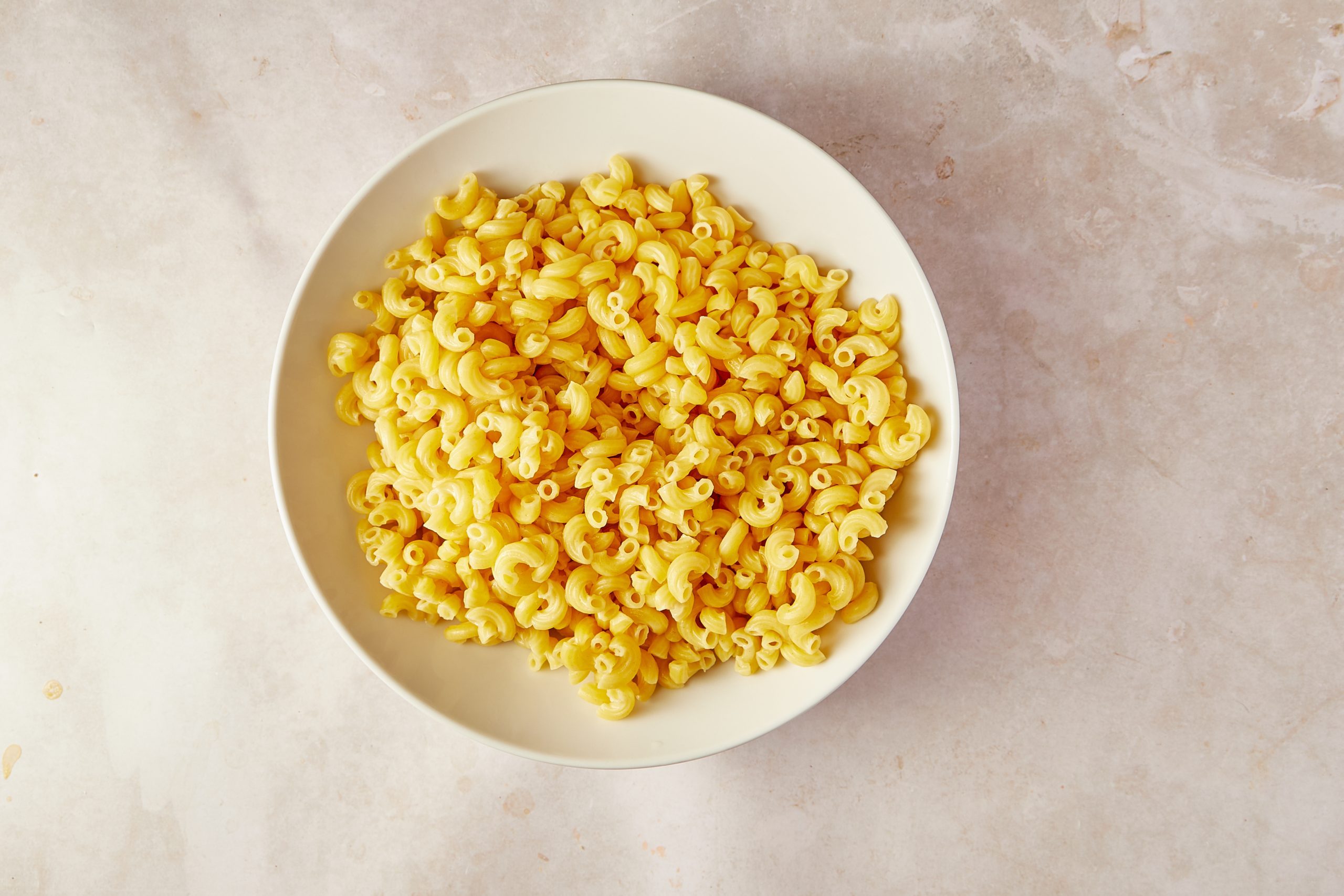 First cook the noodles for Amish Macaroni Salad.