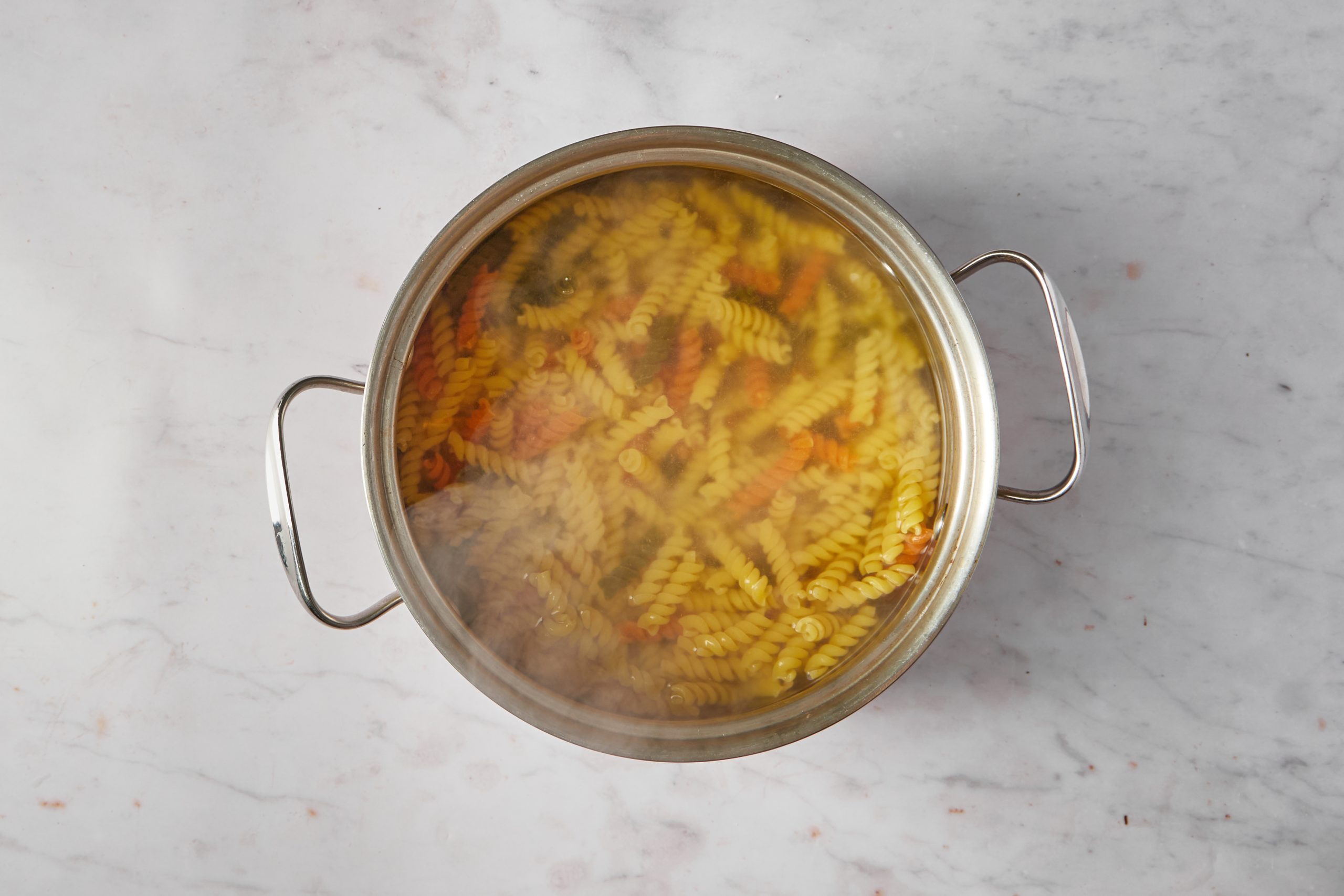 Cook the pasta for pasta salad with Italian dressing