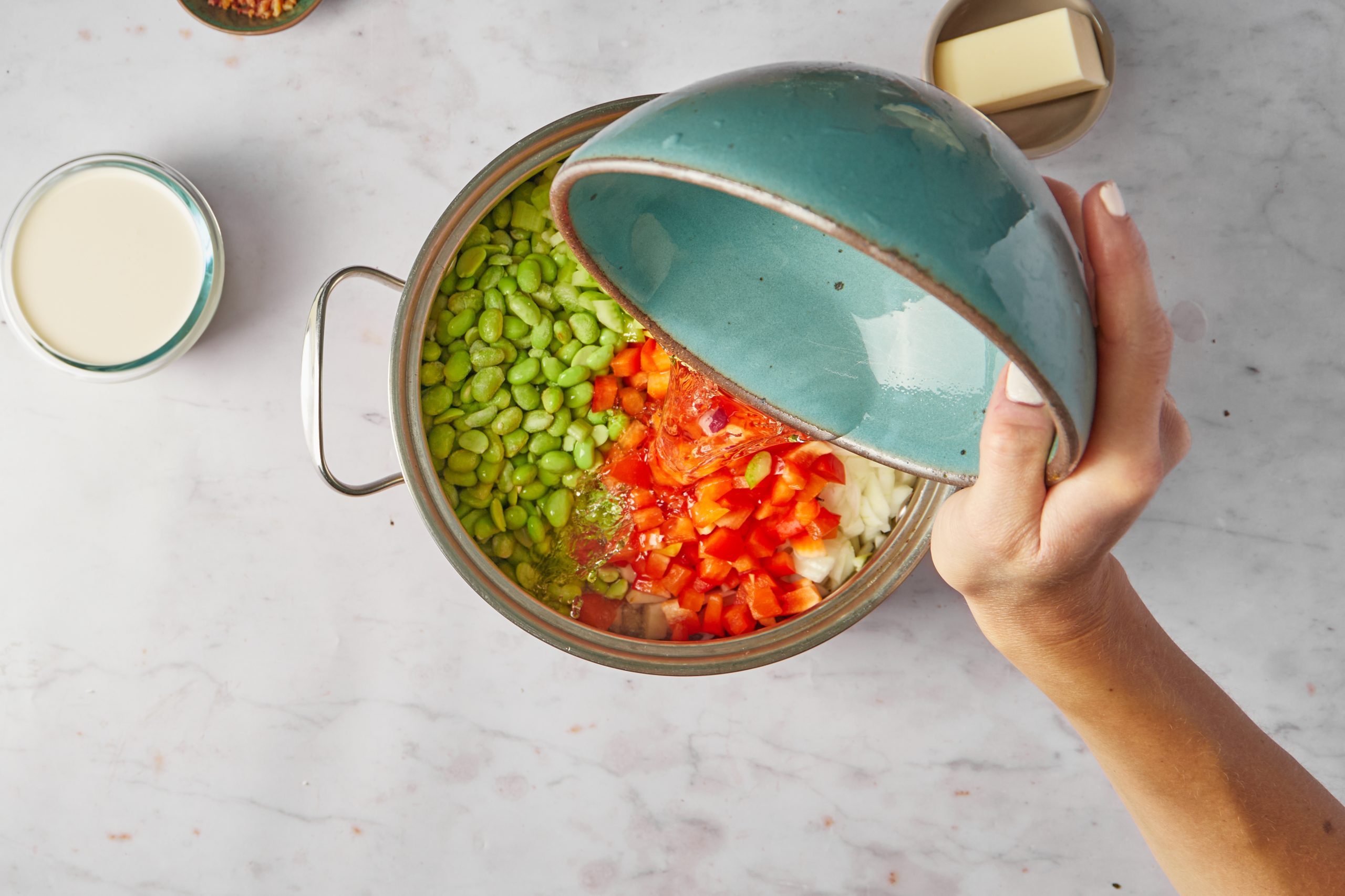 Add the stock to lima bean soup.