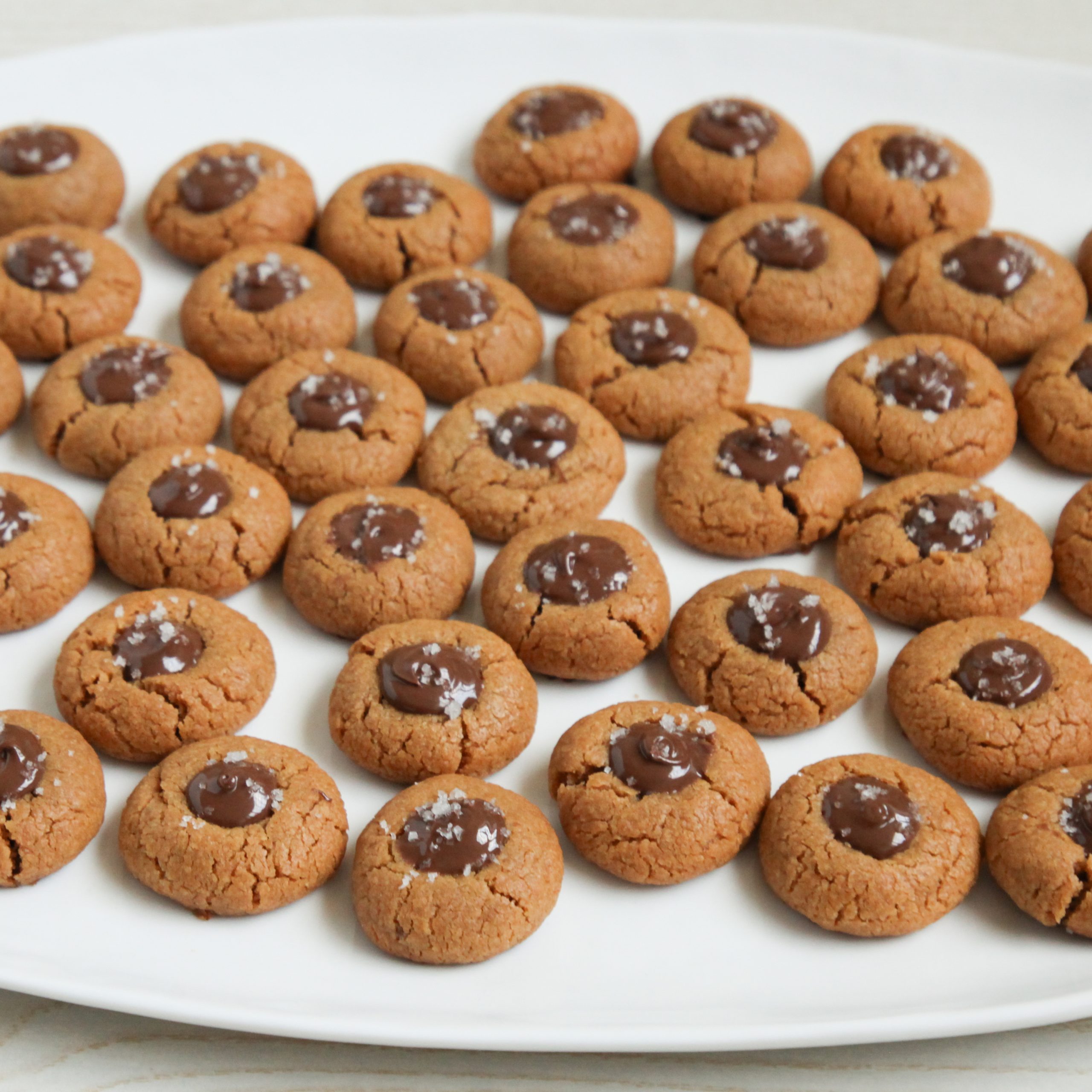 Peanut Butter Thumbprint Cookies on a white platter