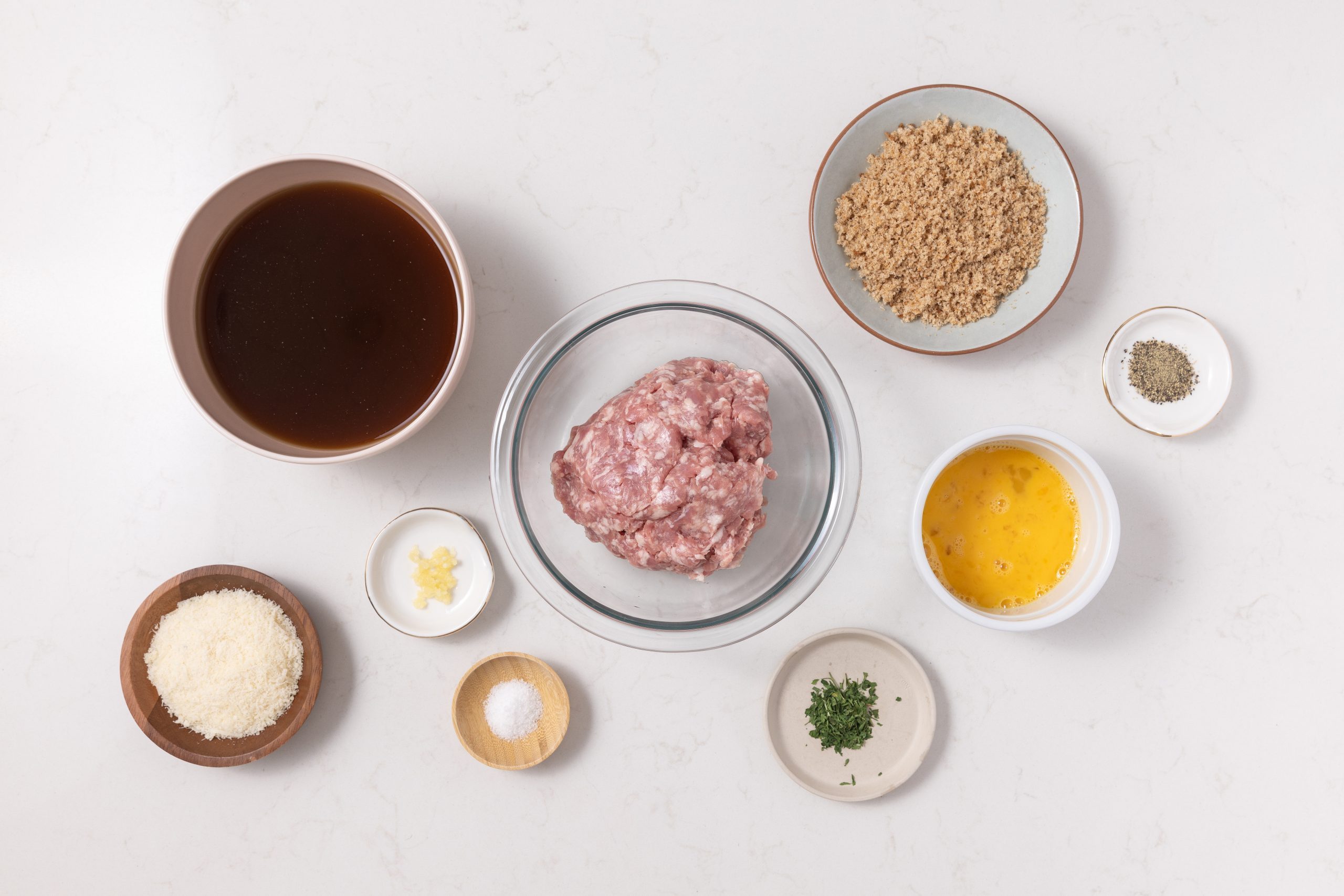 Ingredients for pork meatballs on kitchen counter.