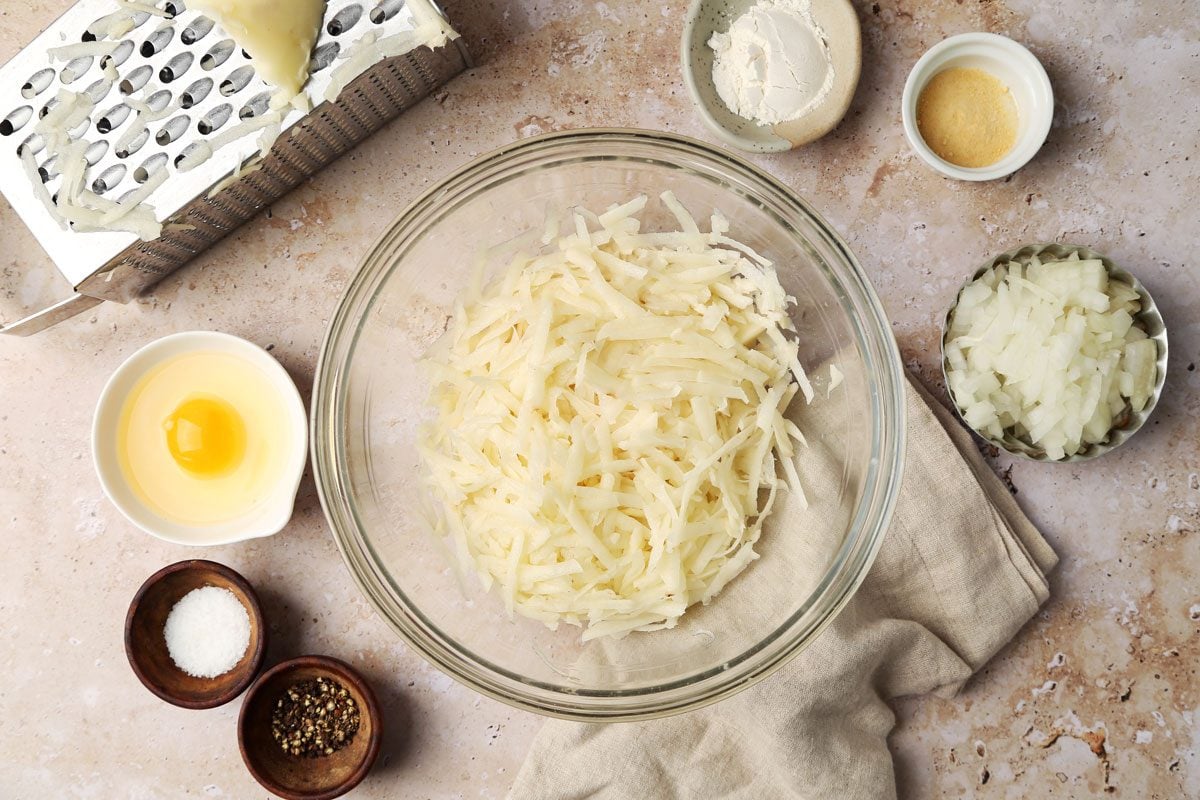 How to make Taste of Home's Potato Pancakes on a brown marble surface.