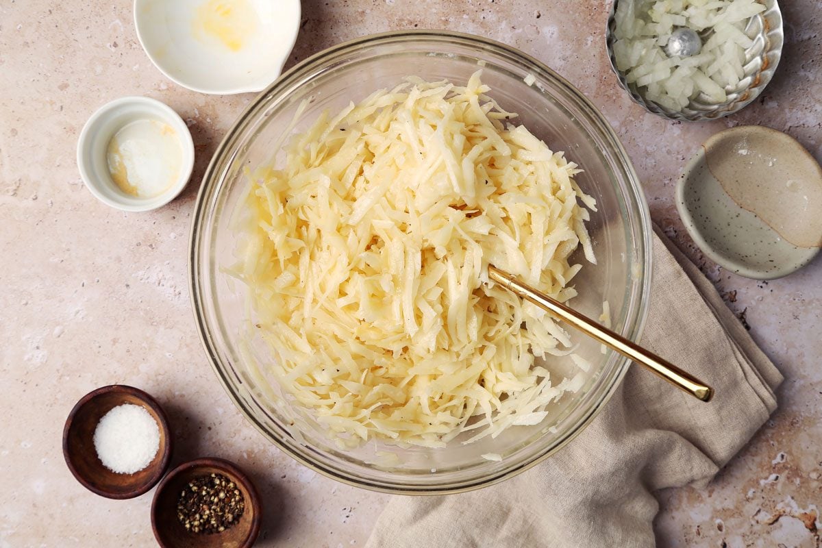 How to make Taste of Home's Potato Pancakes on a brown marble surface.