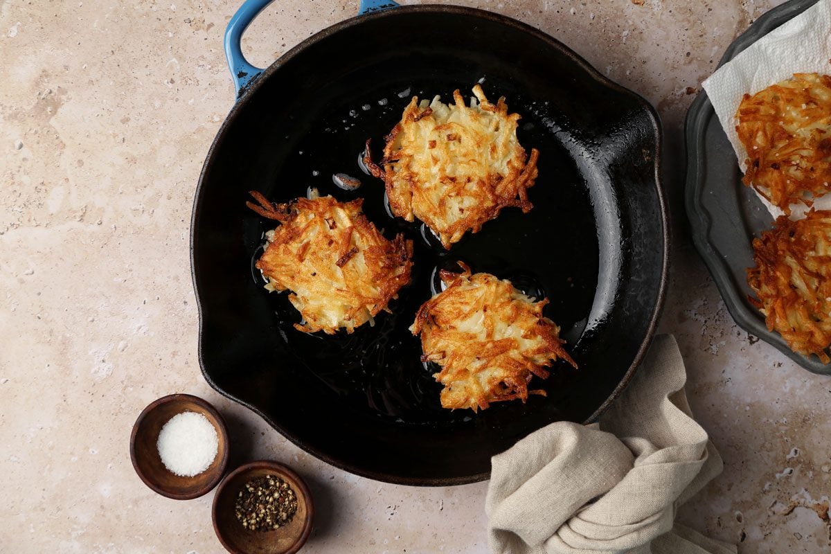 How to make Taste of Home's Potato Pancakes on a brown marble surface.