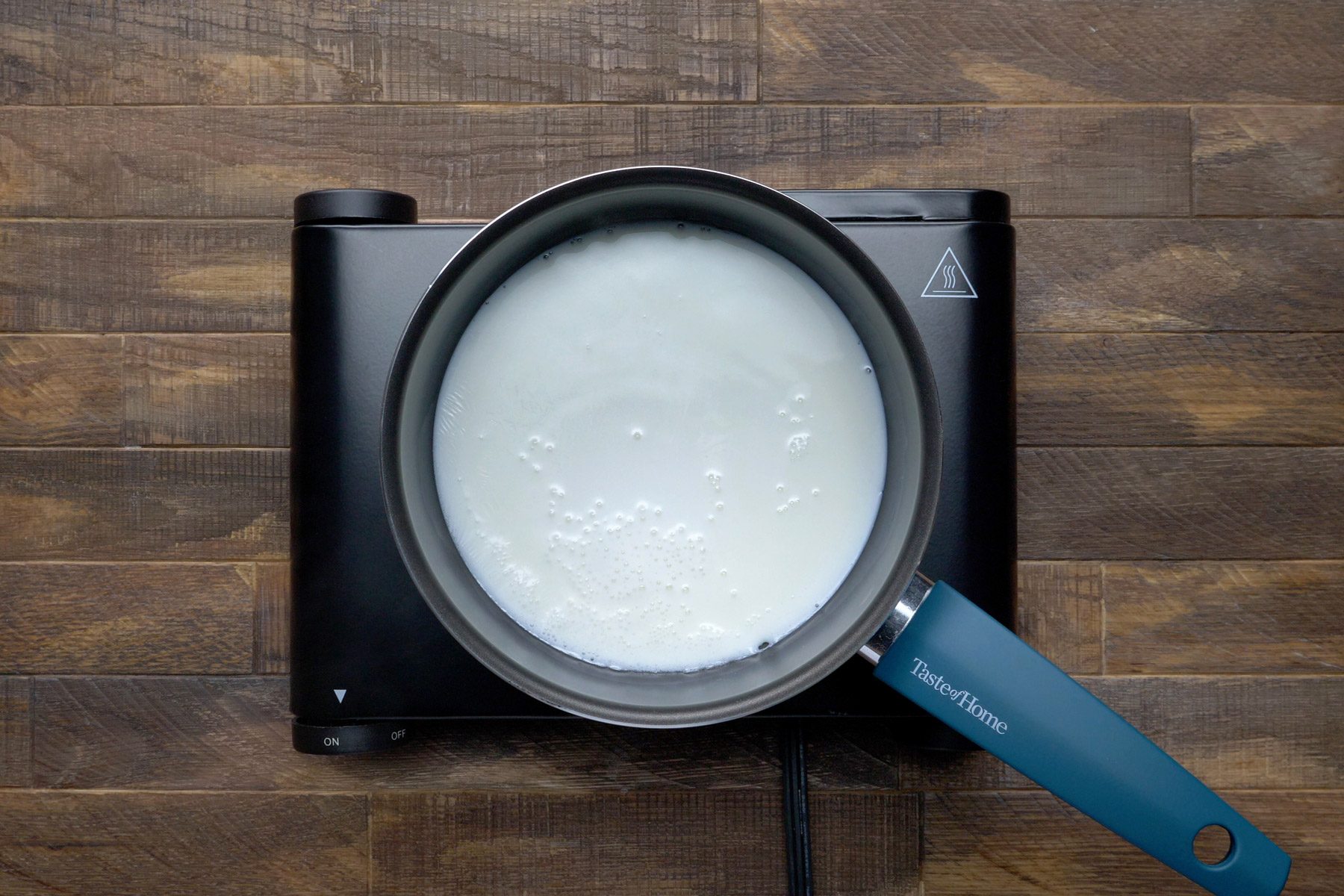 milk heating in a saucepan.