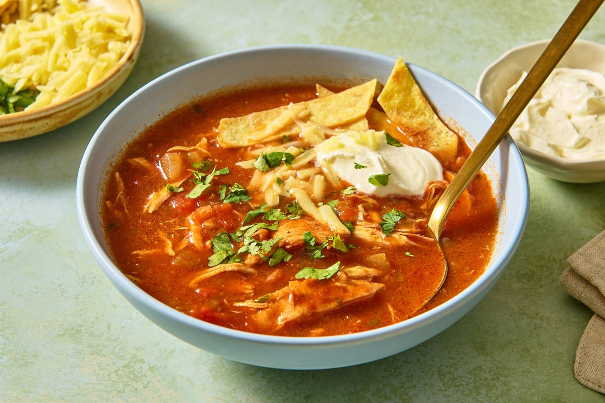 Closeup of a bowl of slow cooker chicken enchilada soup