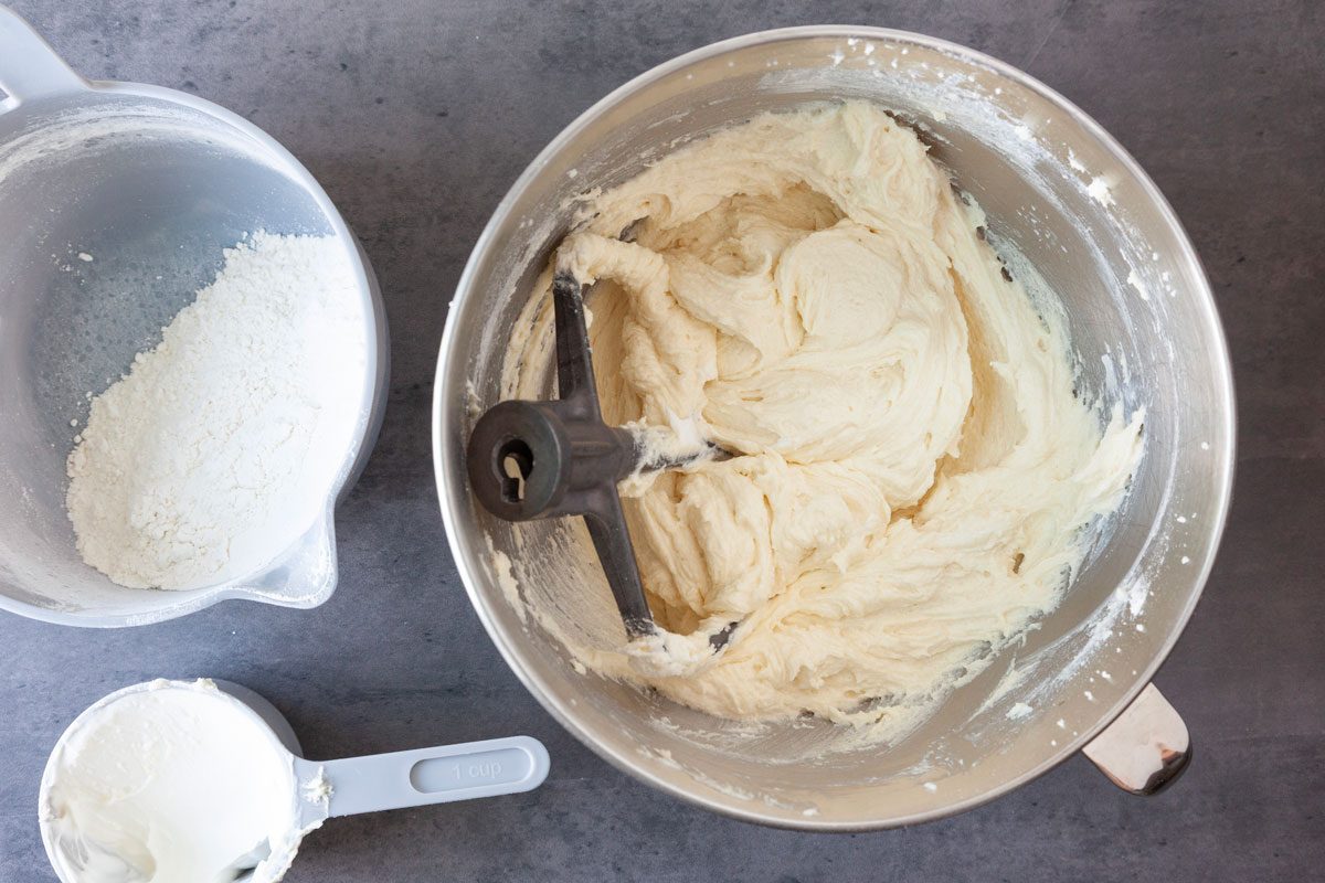 Step 2 of Taste of Home Sour Cream Coffee Cake Bundt is to cream the butter and sugar until light and fluffy, five to seven minutes. Add the eggs, one at a time, beating well after each addition. Beat in the vanilla. Combine flour, baking powder, baking soda and salt; add to creamed mixture alternately with sour cream, beating well after each addition.