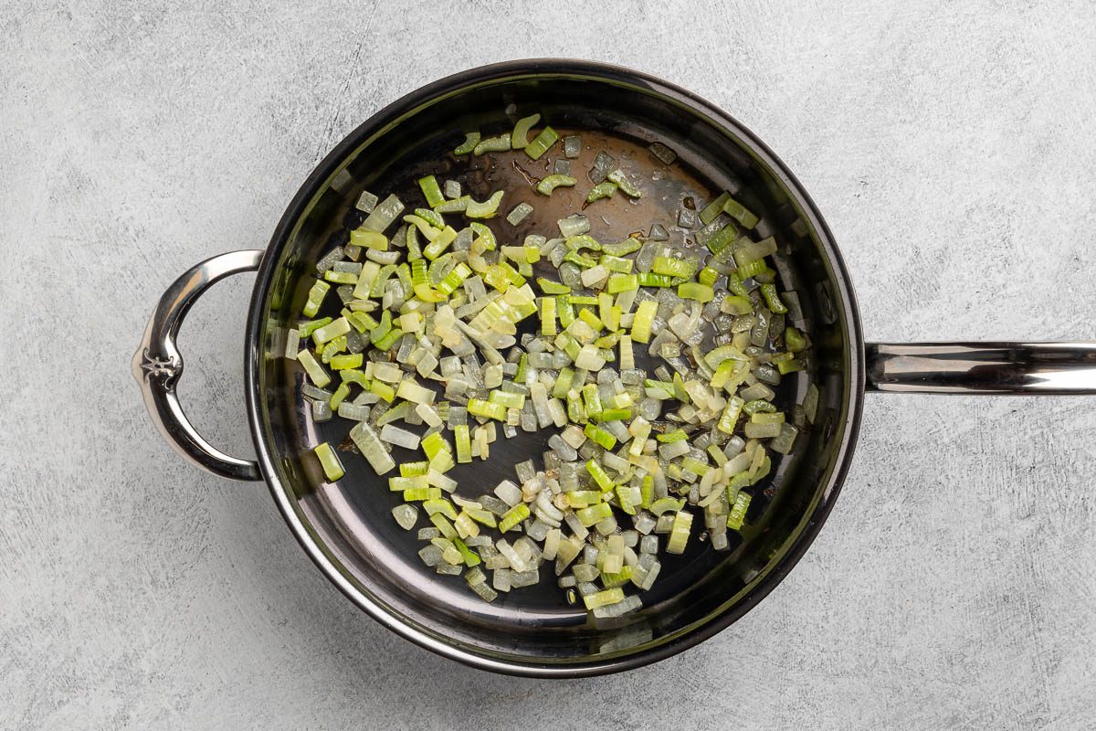 Taste of Home Southern Dressing recipe photo of sauteeing the celery and onion in a skillet.