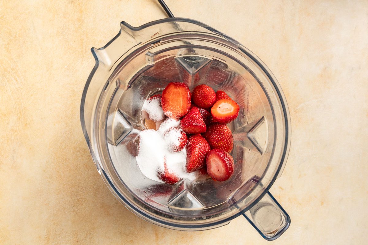 Taste of Home Strawbery Popsicles recipe photo of the strawberries, lemon juice and sugar in a blender to puree.