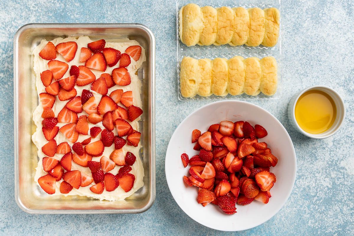 Taste of Home Strawberry Tiramisu recipe photo of layering the ingredients in a 13 x 9 dish.