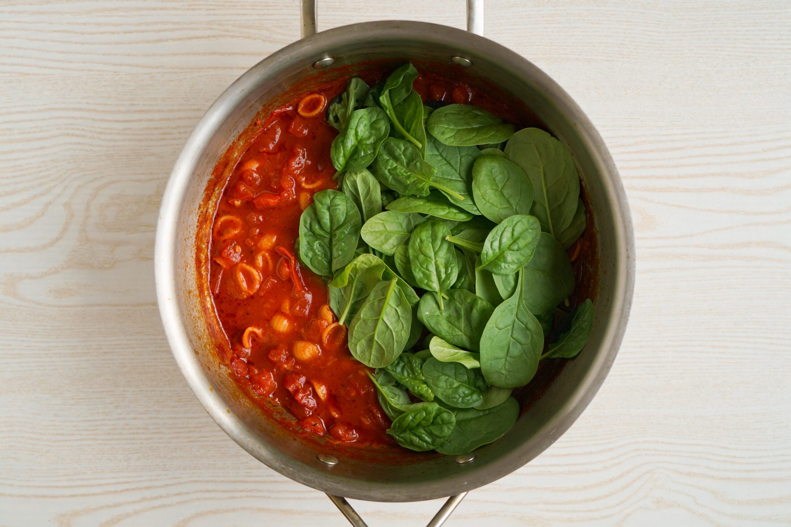 Adding spinach to Tomato Florentine Soup