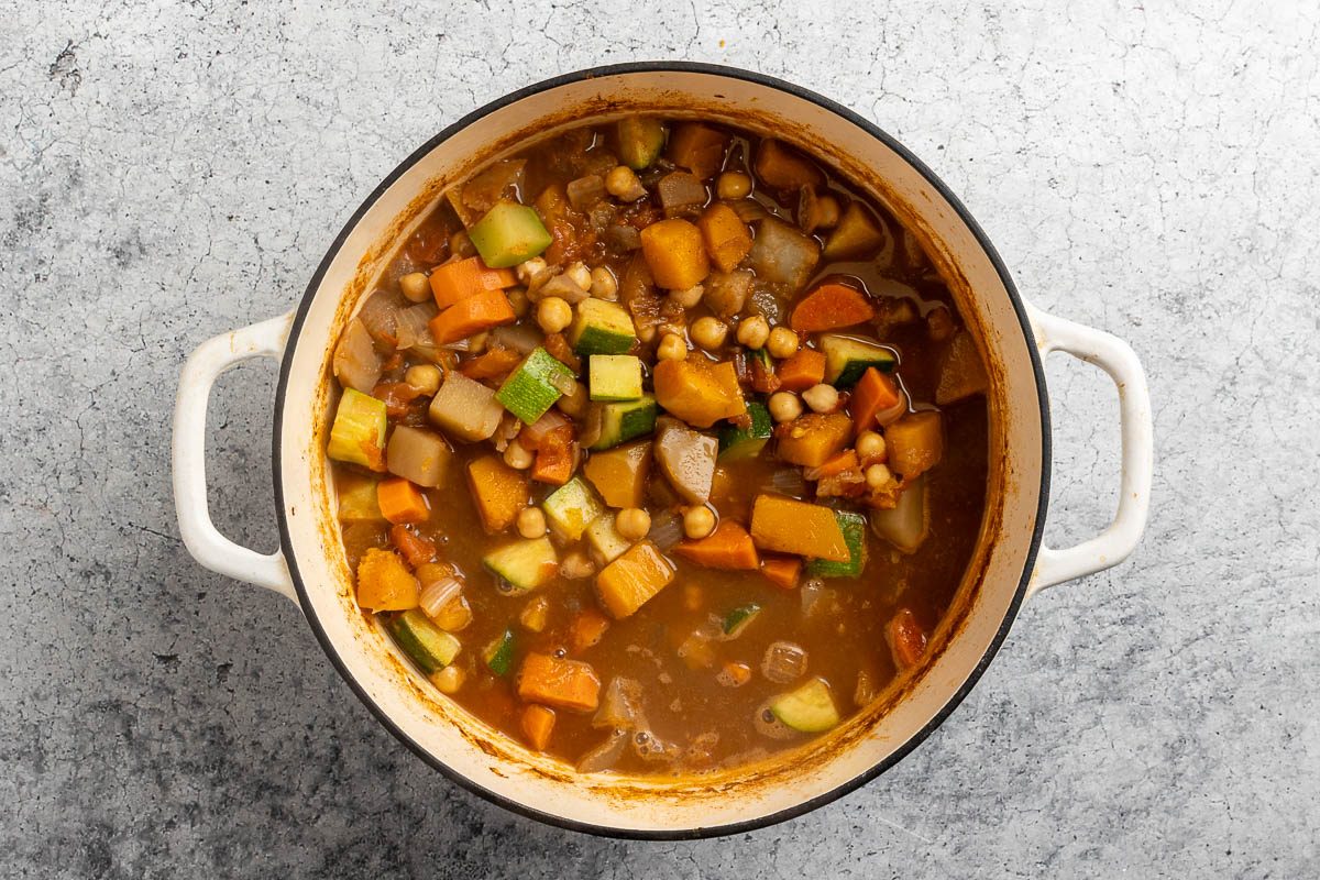 Taste of Home Vegetable Stew recipe photo of the zucchini and tomatoes added to the dutch oven.