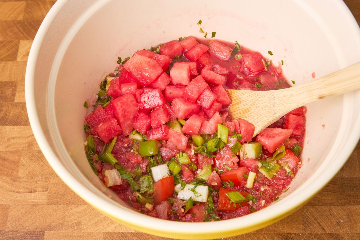 Close up of ingredients in bowl ready to be served with wooden spoon