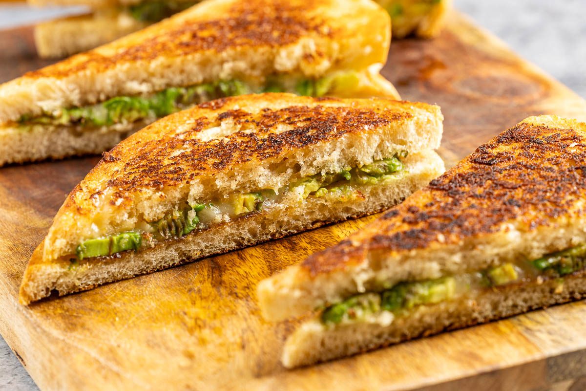 Taste of Home Avocado Grilled Cheese recipe photo of the finished sandwiches cut in half.