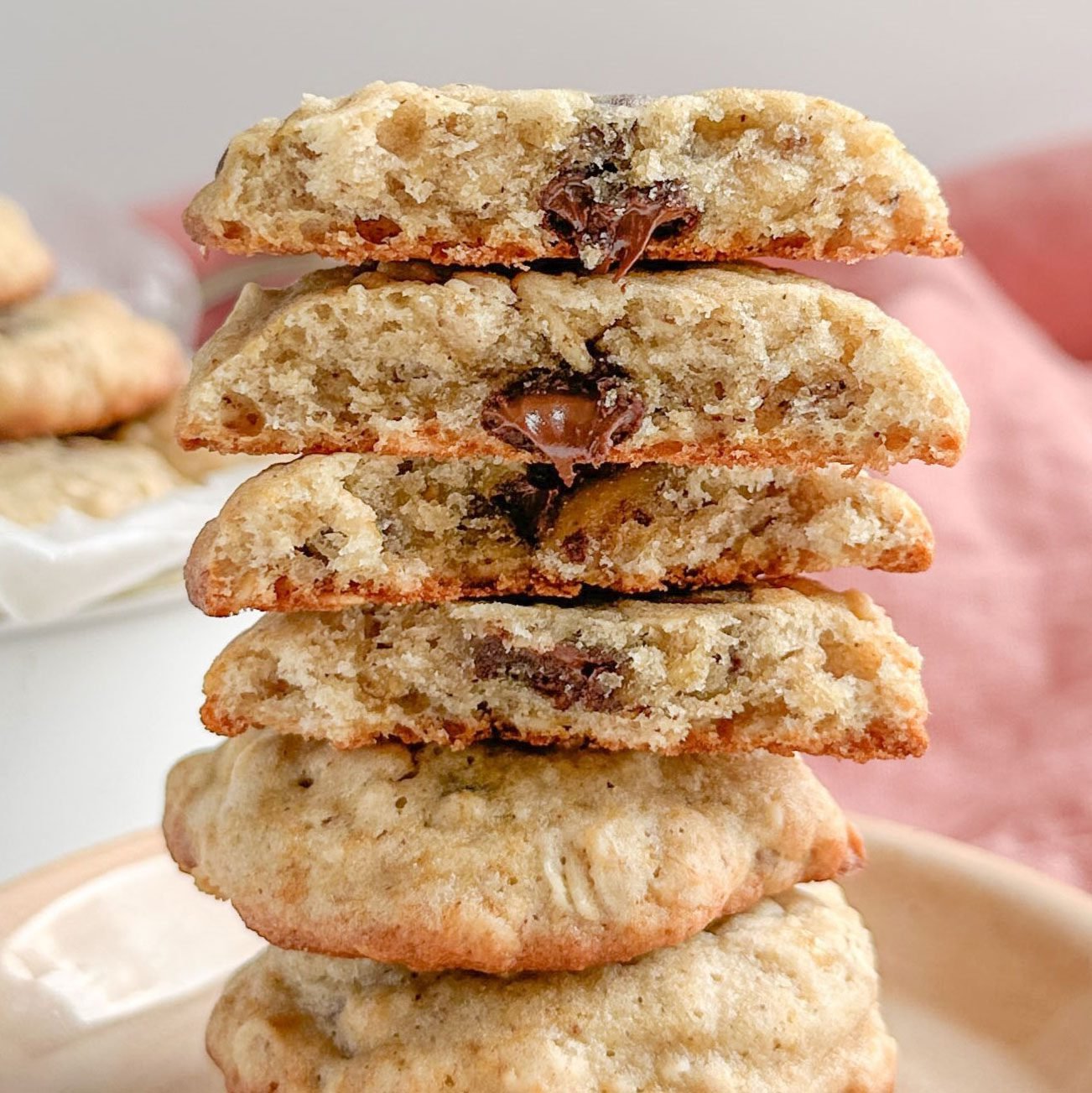 Taste Recipes Banana Oatmeal Cookies stacked on a pink ceramic plate