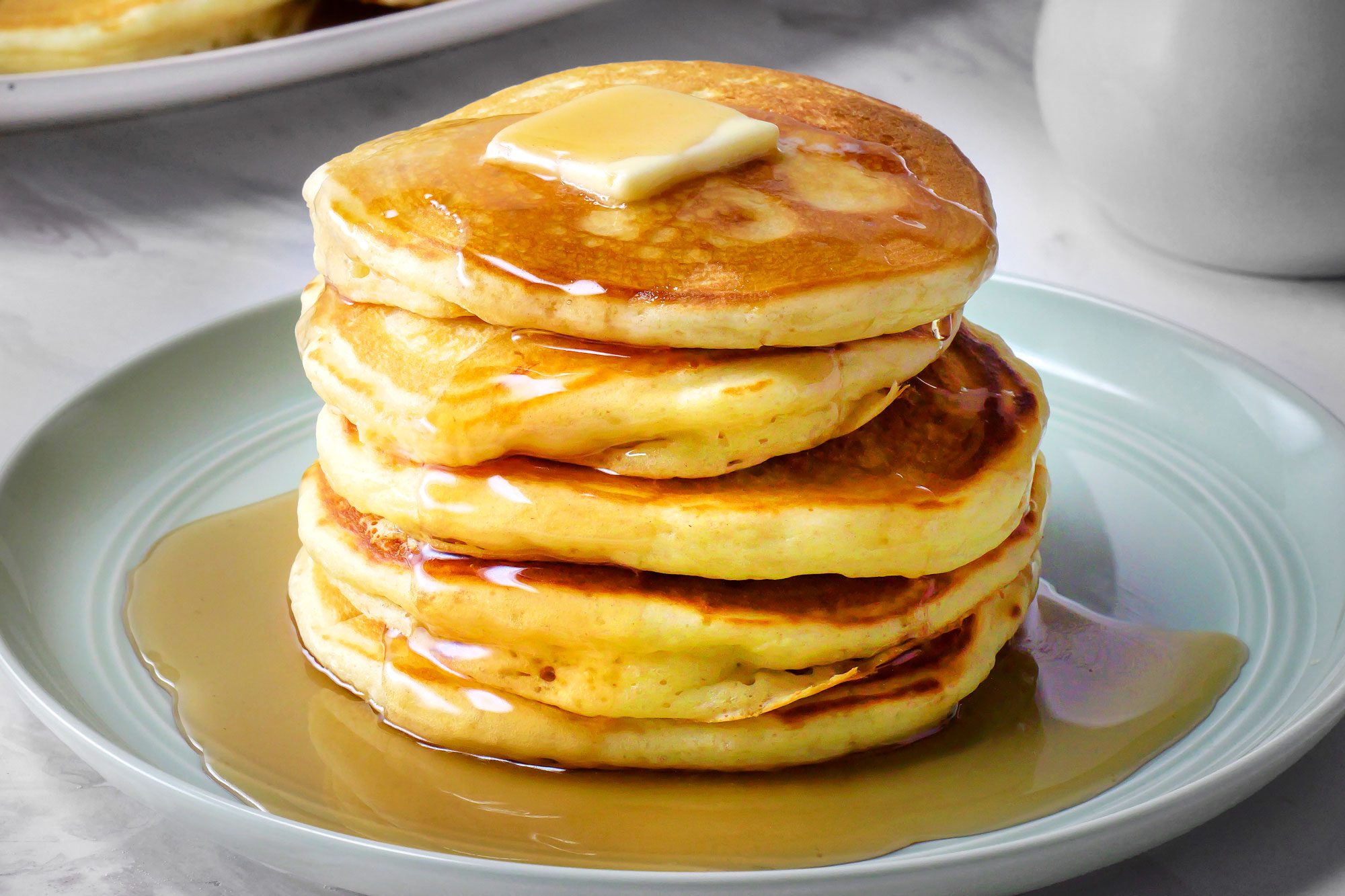 3/4th shot of buttermilk pancakes with butter