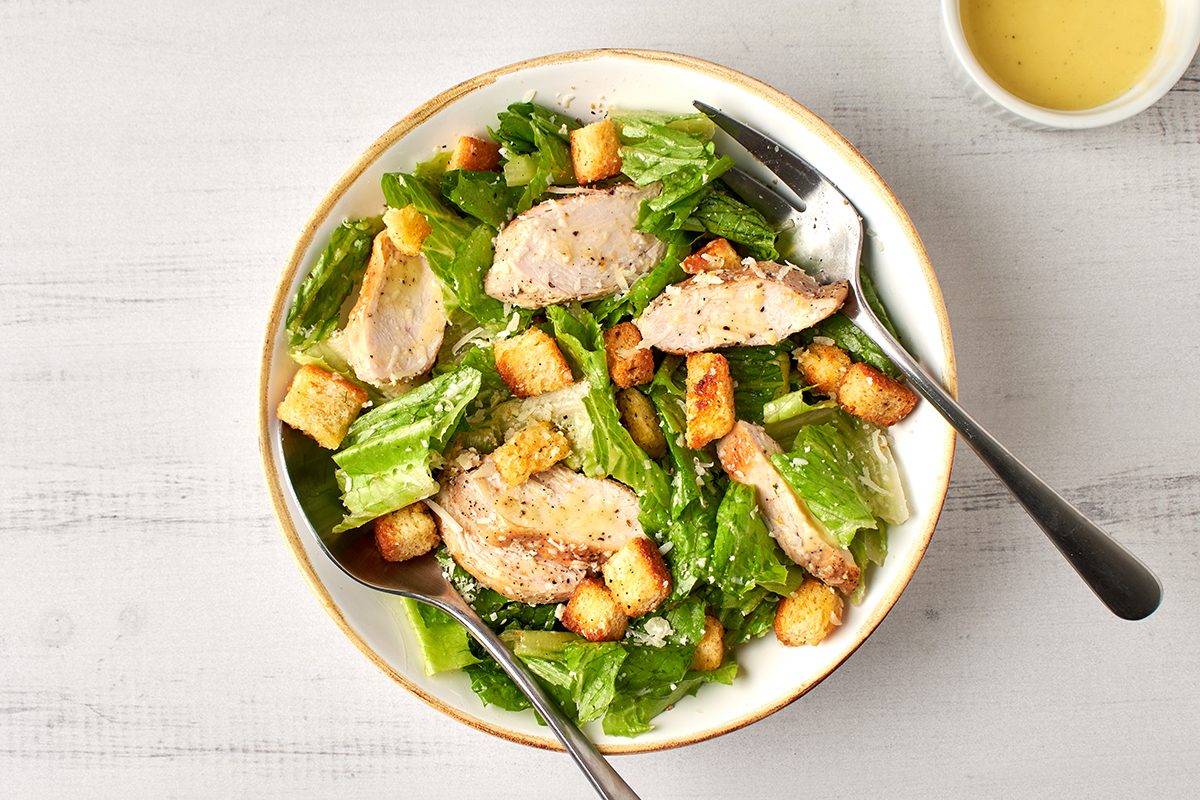 Ready in just 10 minutes, this classic chicken caesar salad by Taste of Home features tender chicken breast, crisp romaine and a zesty homemade dressing.