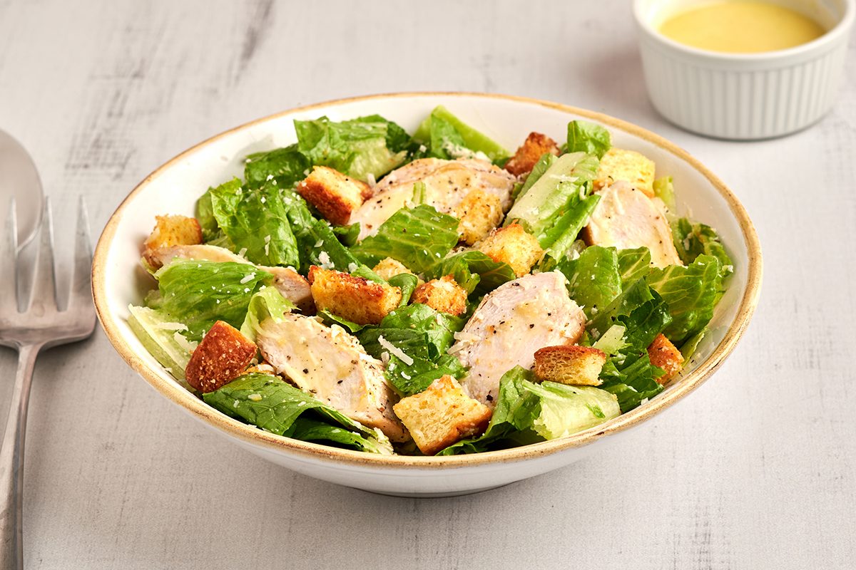 Ready in just 10 minutes, this classic chicken caesar salad by Taste of Home features tender chicken breast, crisp romaine and a zesty homemade dressing.