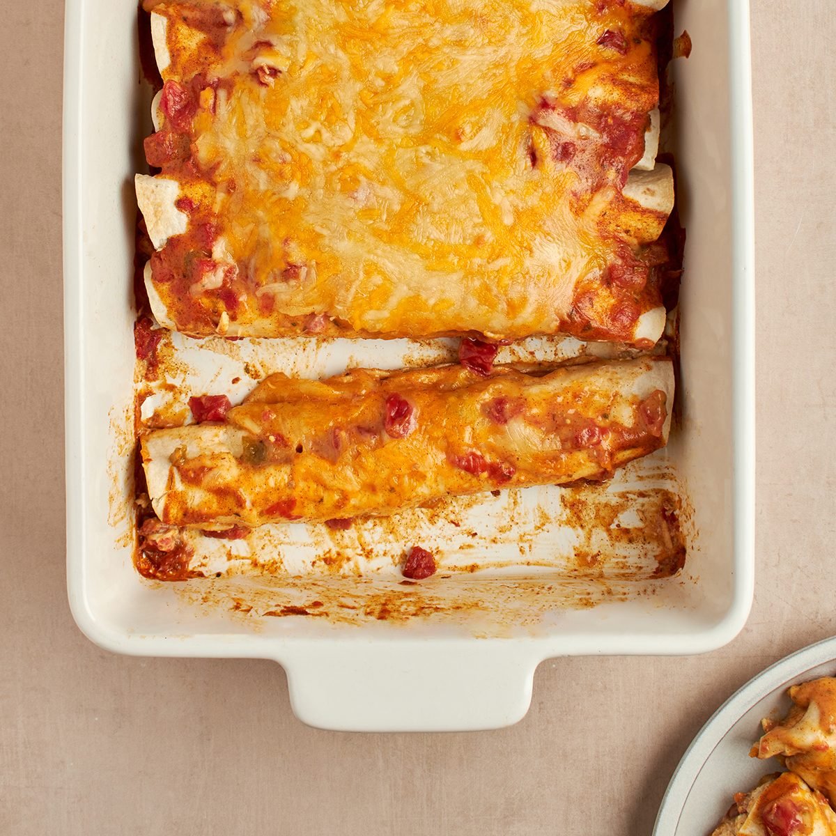 Find comfort and deliciousness in these easy-to-make chicken enchiladas with cream of chicken soup by Taste of Home.