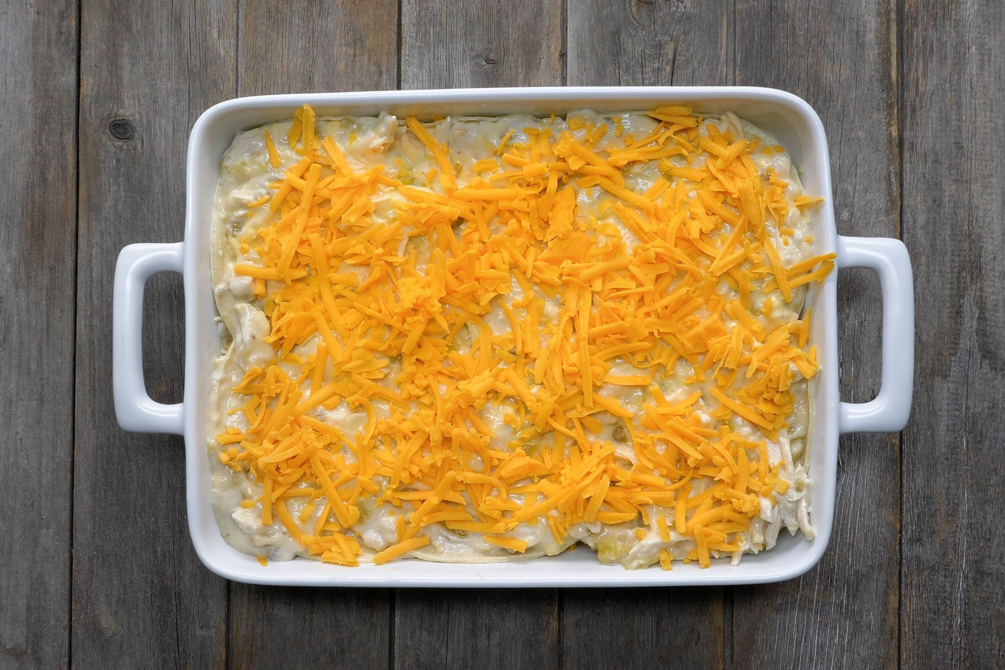 top with cheese layer; wooden background;