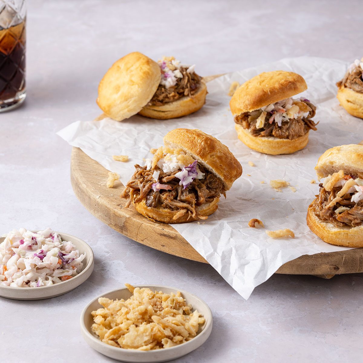 Pulled pork served on biscuits with colewslaw and french fried onions.