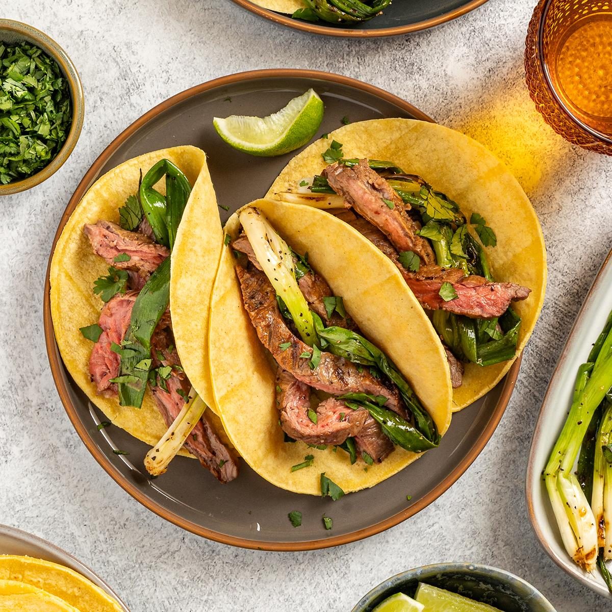 Grilled Onion Skirt Steak Tacos