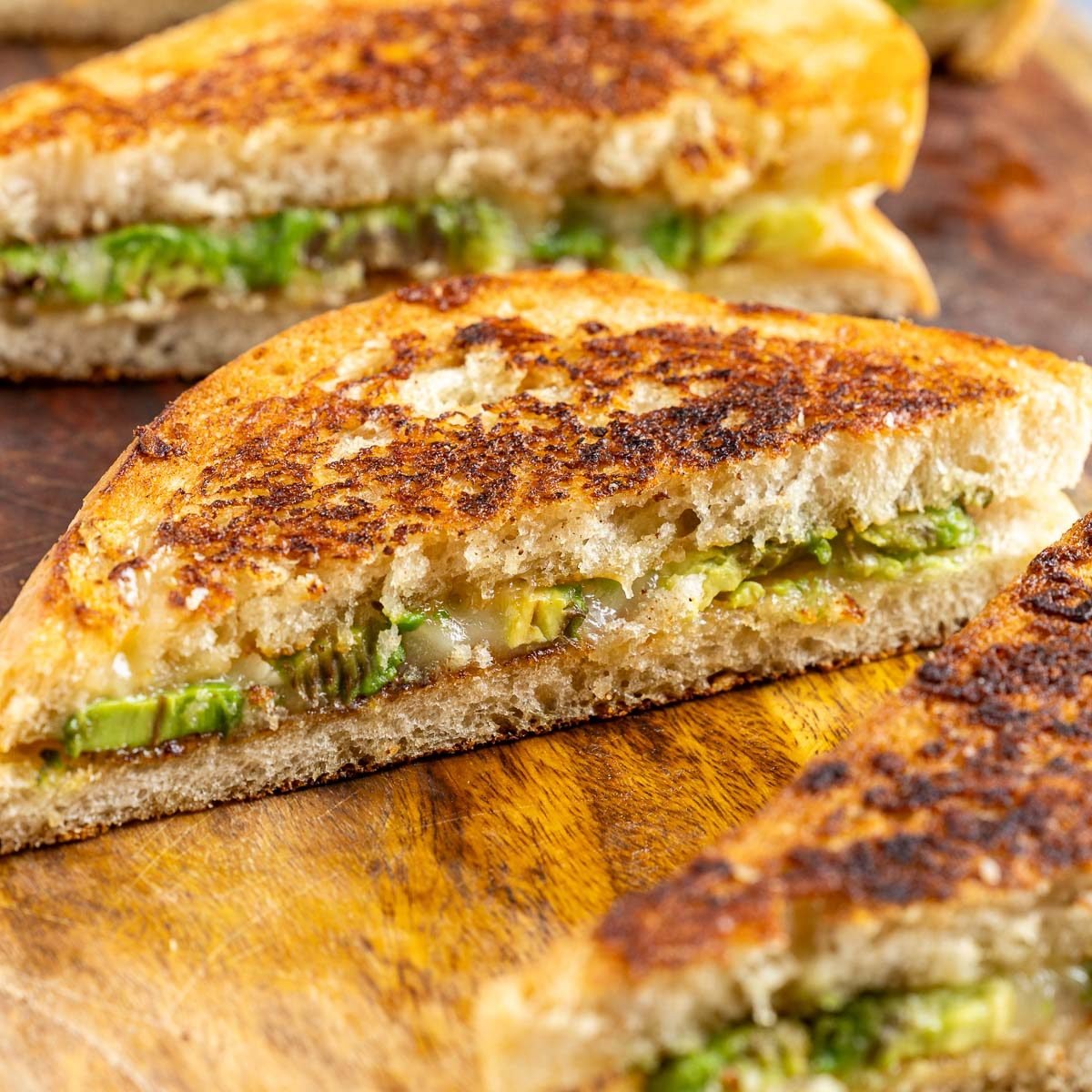 Taste of Home Avocado Grilled Cheese recipe photo of the finished sandwiches cut in half.