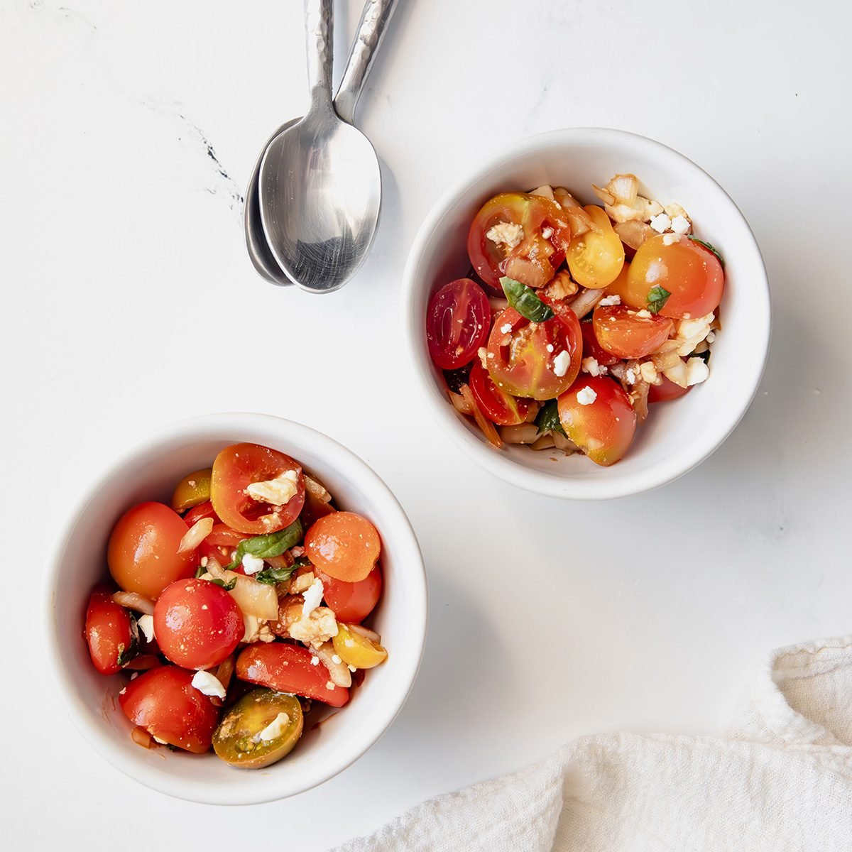 EXPS Overhead beauty shot for Taste of Home Tomato Feta Salad being served in two bowls.