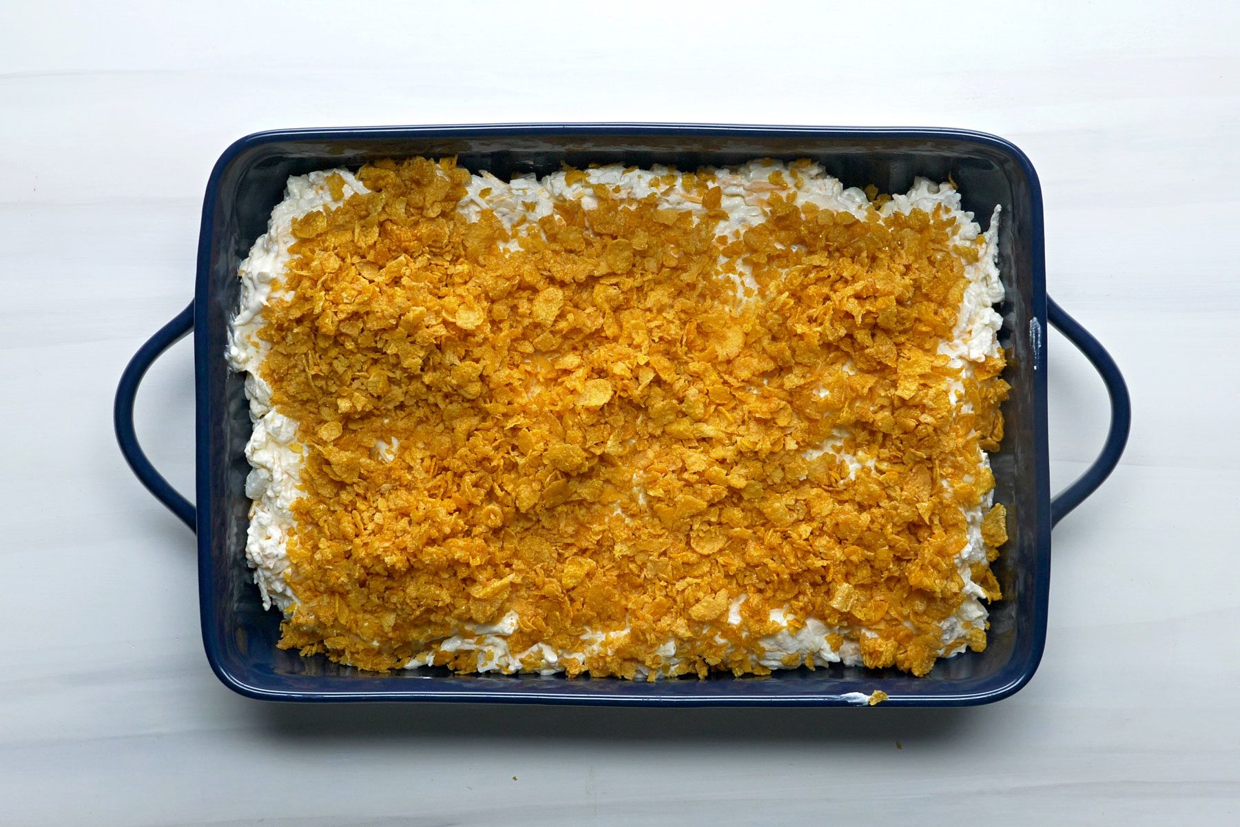 crushed cornflakes spread over potato mixture.