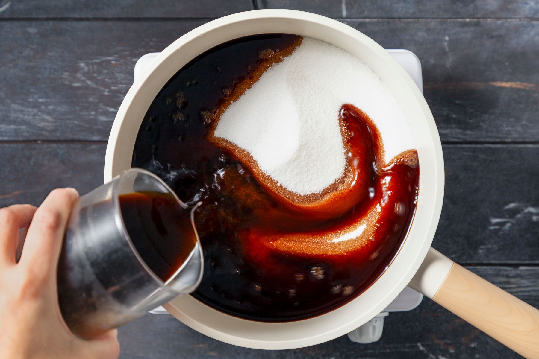 Espresso and sugar in a large saucepan.