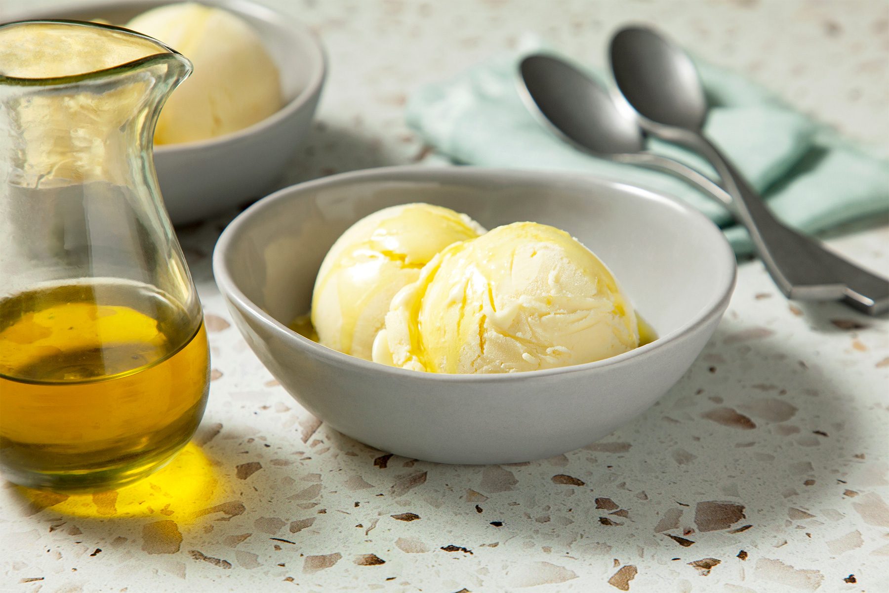 wide shot of olive oil ice cream served with olive oil