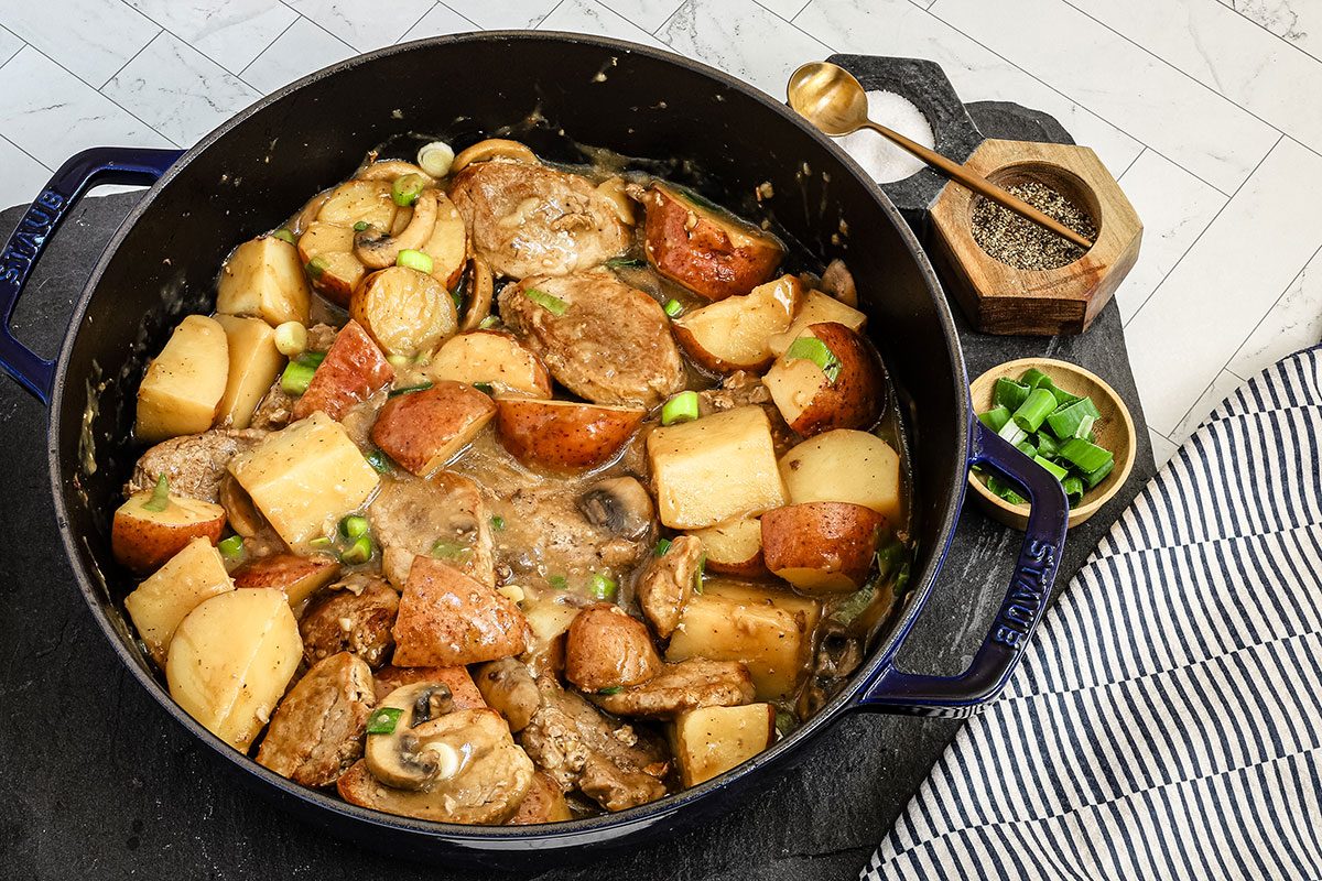 Pork tenderloin and otatoes with mushrooms and green onions in a skillet, from Taste of Home.