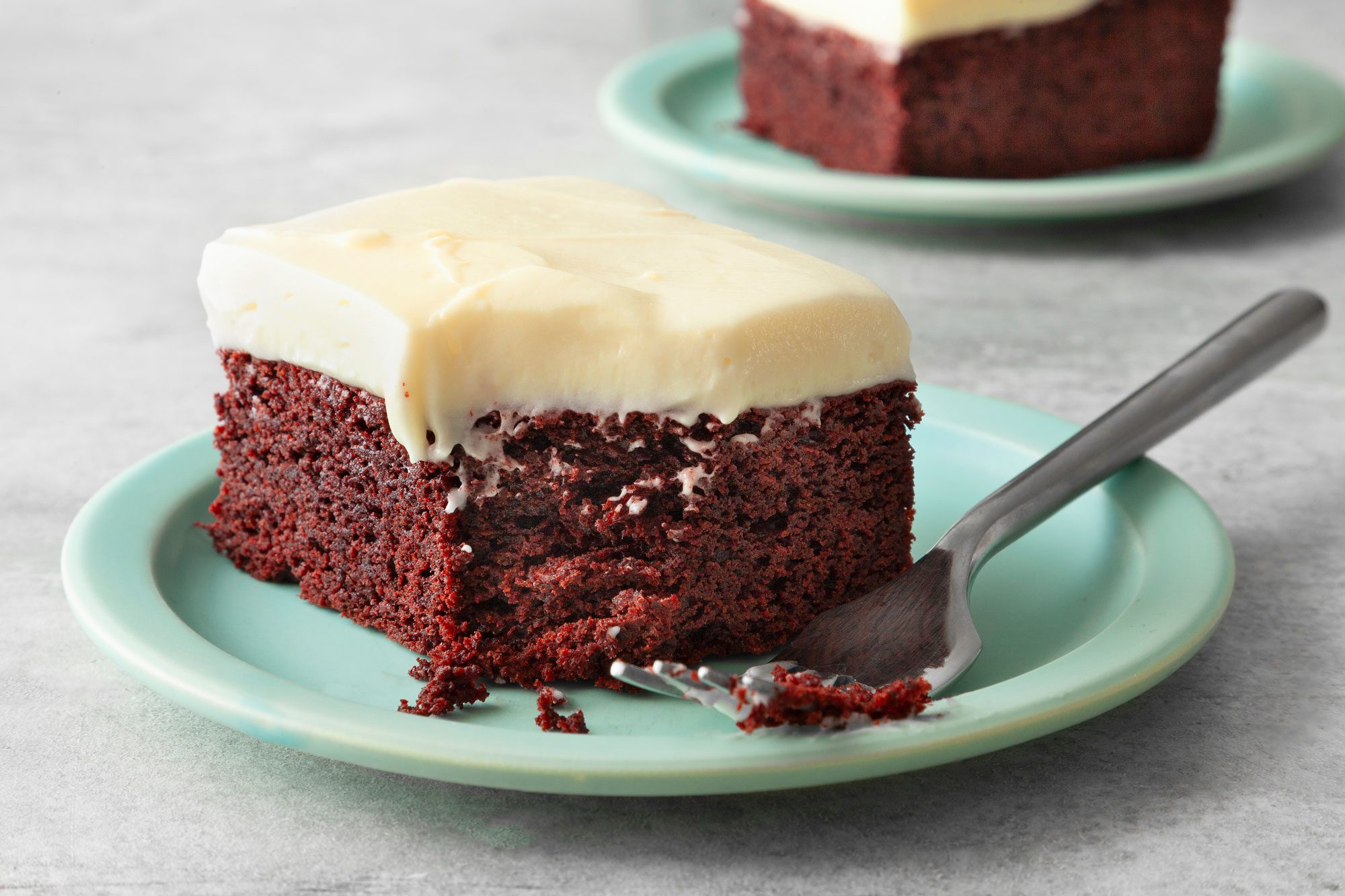 Red Velvet Brownies with Cream Cheese Frosting served in small plates