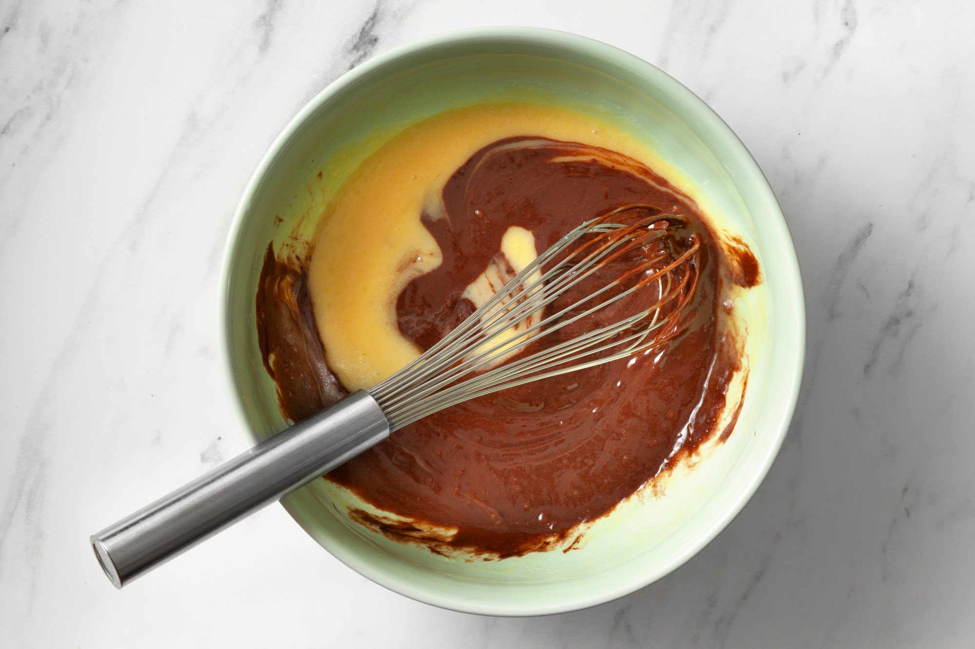 Whisk in melted chocolate until smooth and creamy